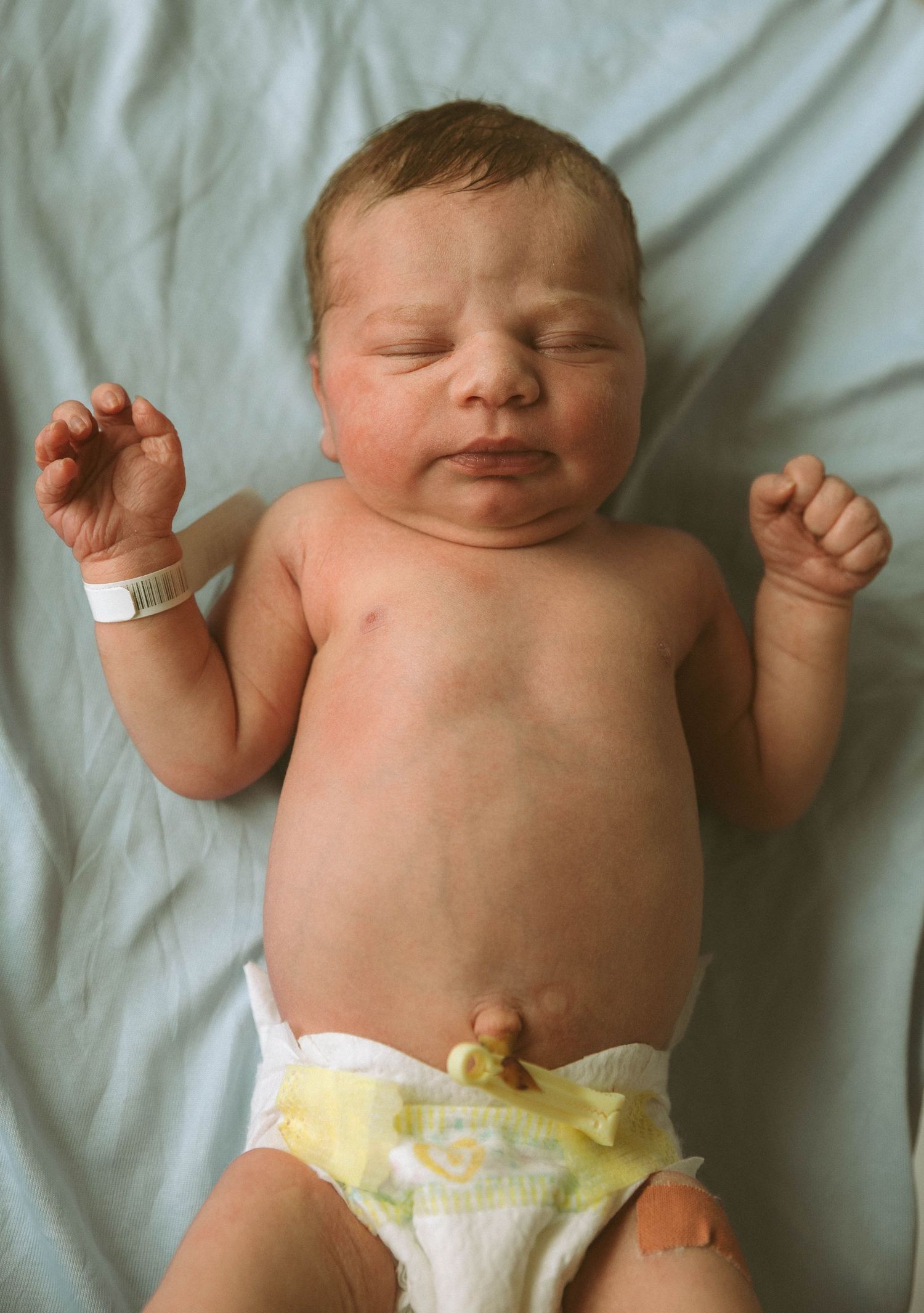 Toronto Fresh 48 newborn photography capturing mother and baby in hospital within first 24 hours after birth