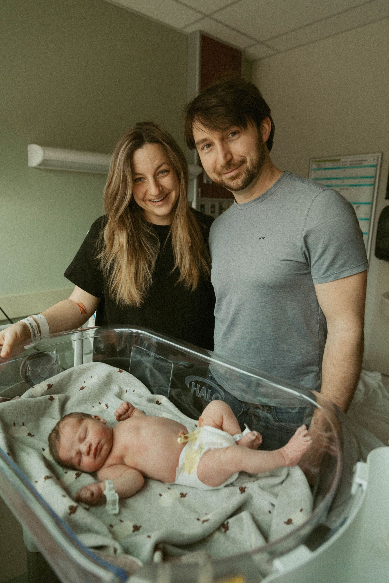 Hamilton Ontario Fresh 48 newborn photography capturing mother holding newborn in hospital