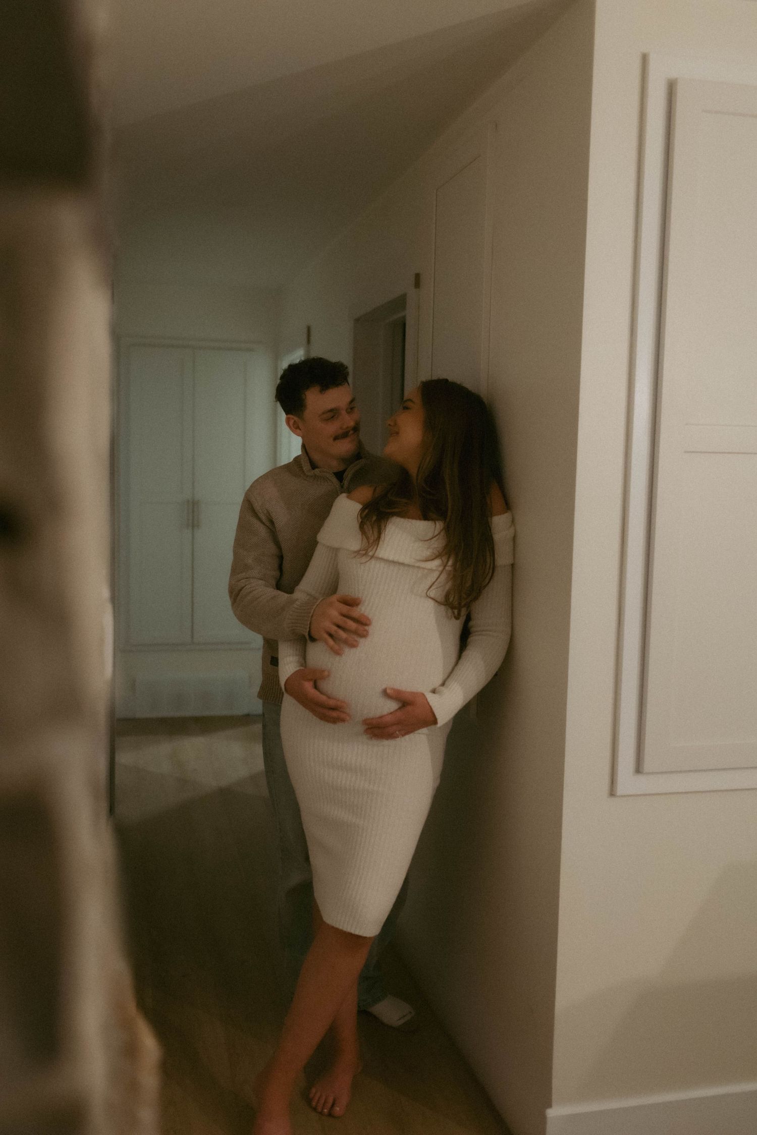 Maternity photography in Woodstock Ontario capturing natural connection, movement, and emotive moments for couples and growing families