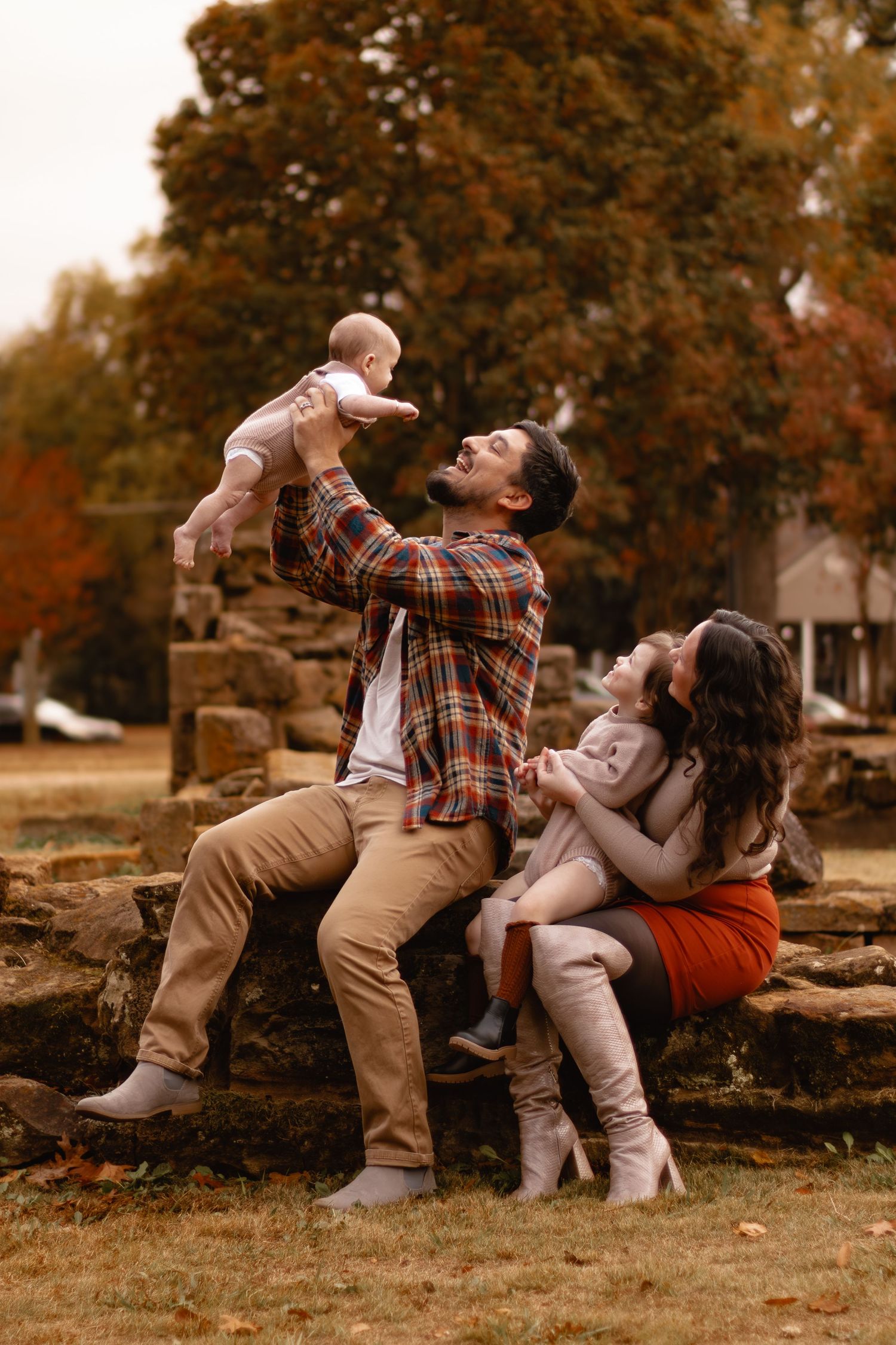 Playful family photos showing movement and laughter during an autumn photo session.
