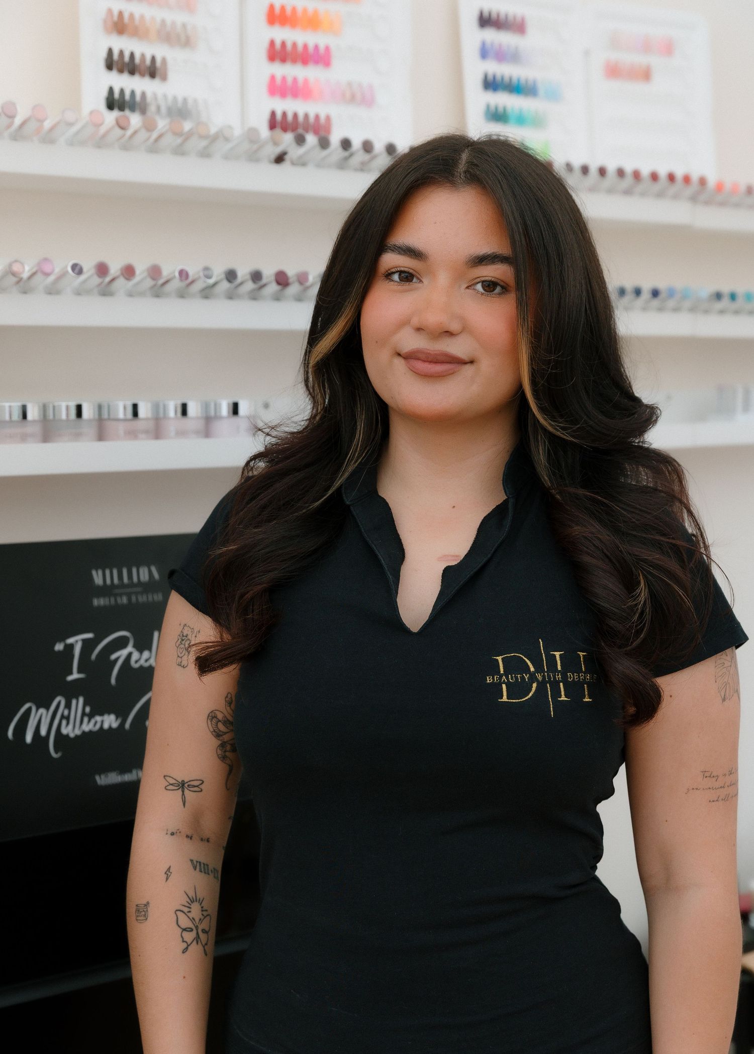 Professional nail polish display with organized color swatches on white shelving.