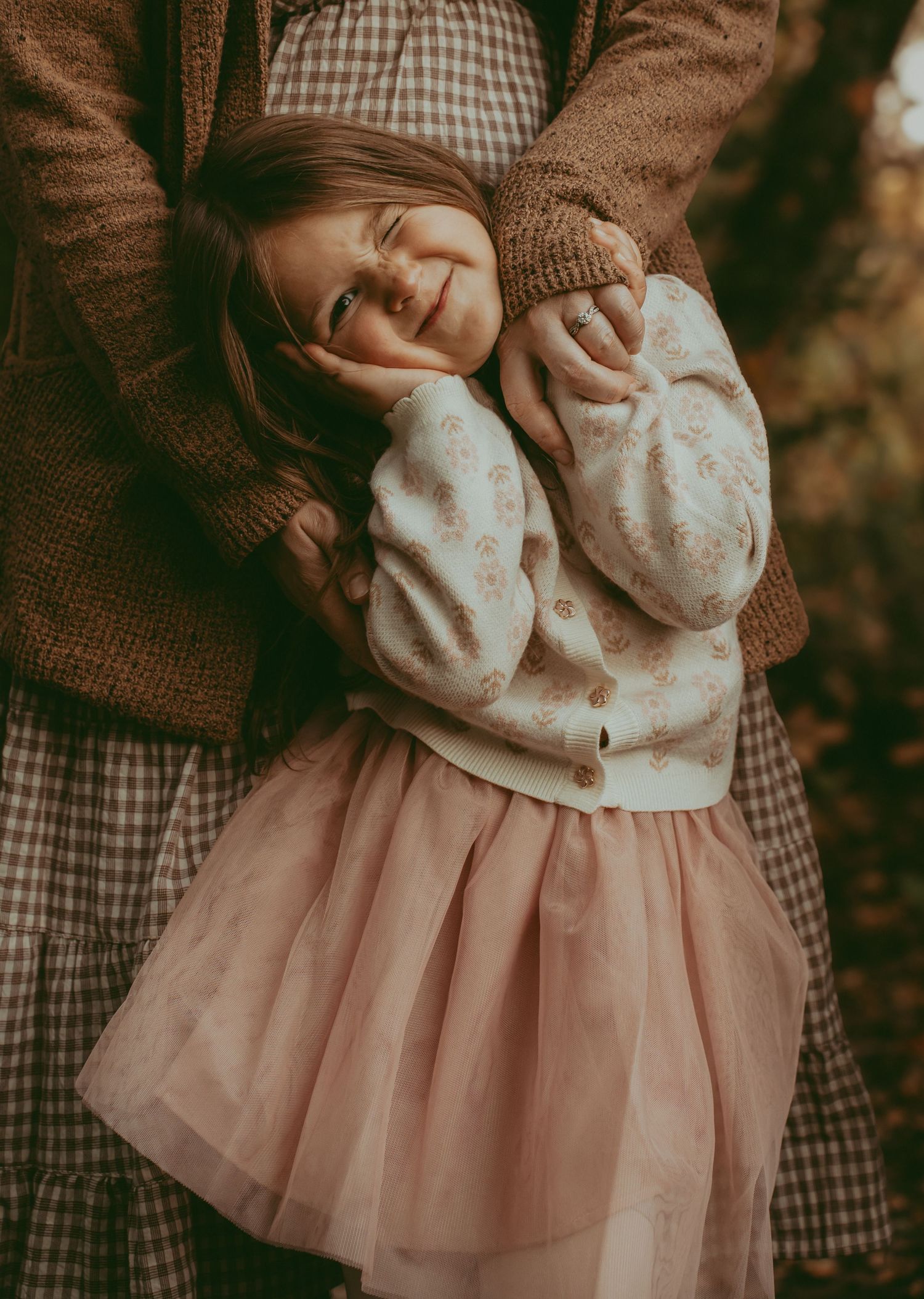 A series of photos showing a pink tulle skirt and brown sweater outfit from different angles and details.