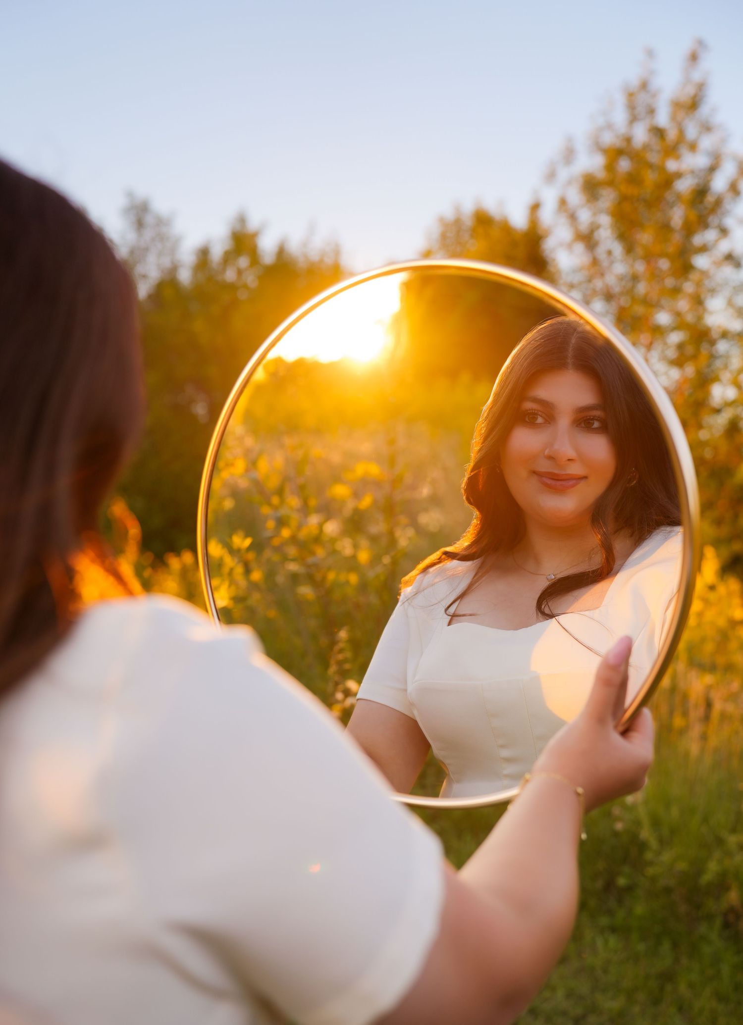 A creative photography series showing a circular mirror reflection at sunset in a natural outdoor setting.