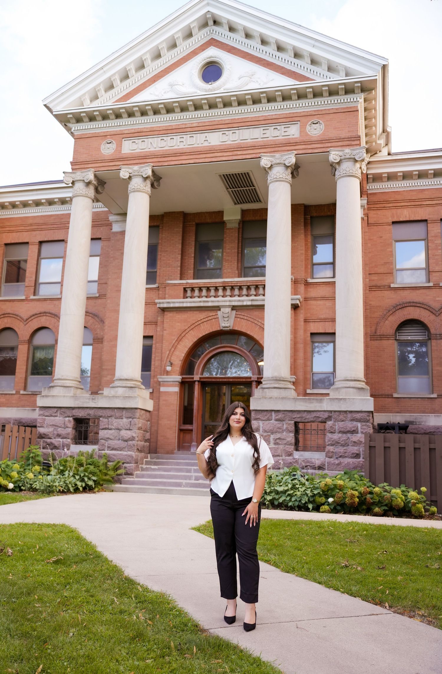 A grand historic building with white columns and brick facade captured from different angles.