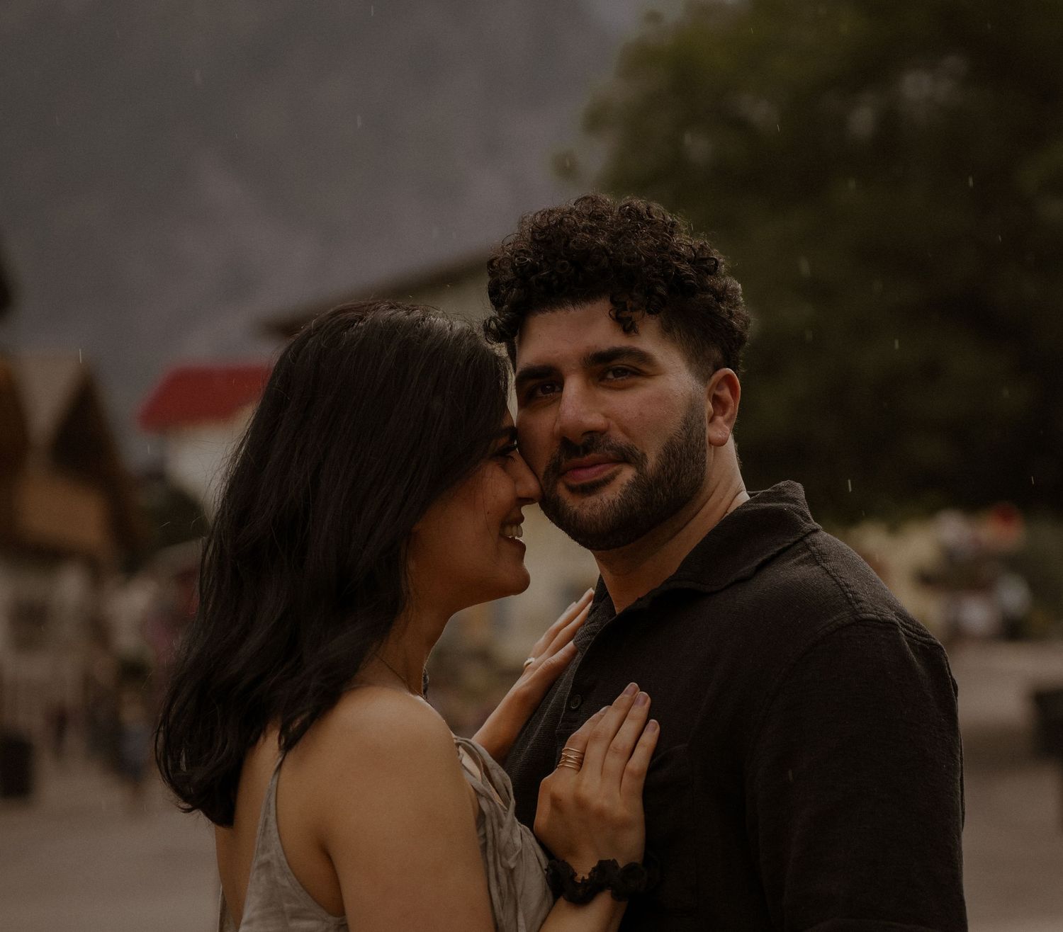 Intimate couple's portrait session in dim evening light.