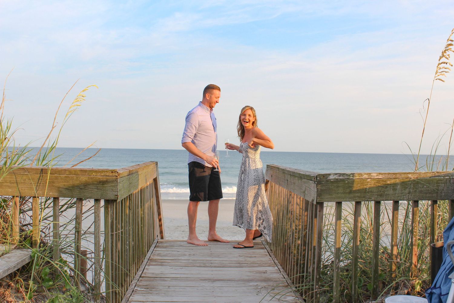 Engagement photograph of a woman and man at a beach in Fairfield County.