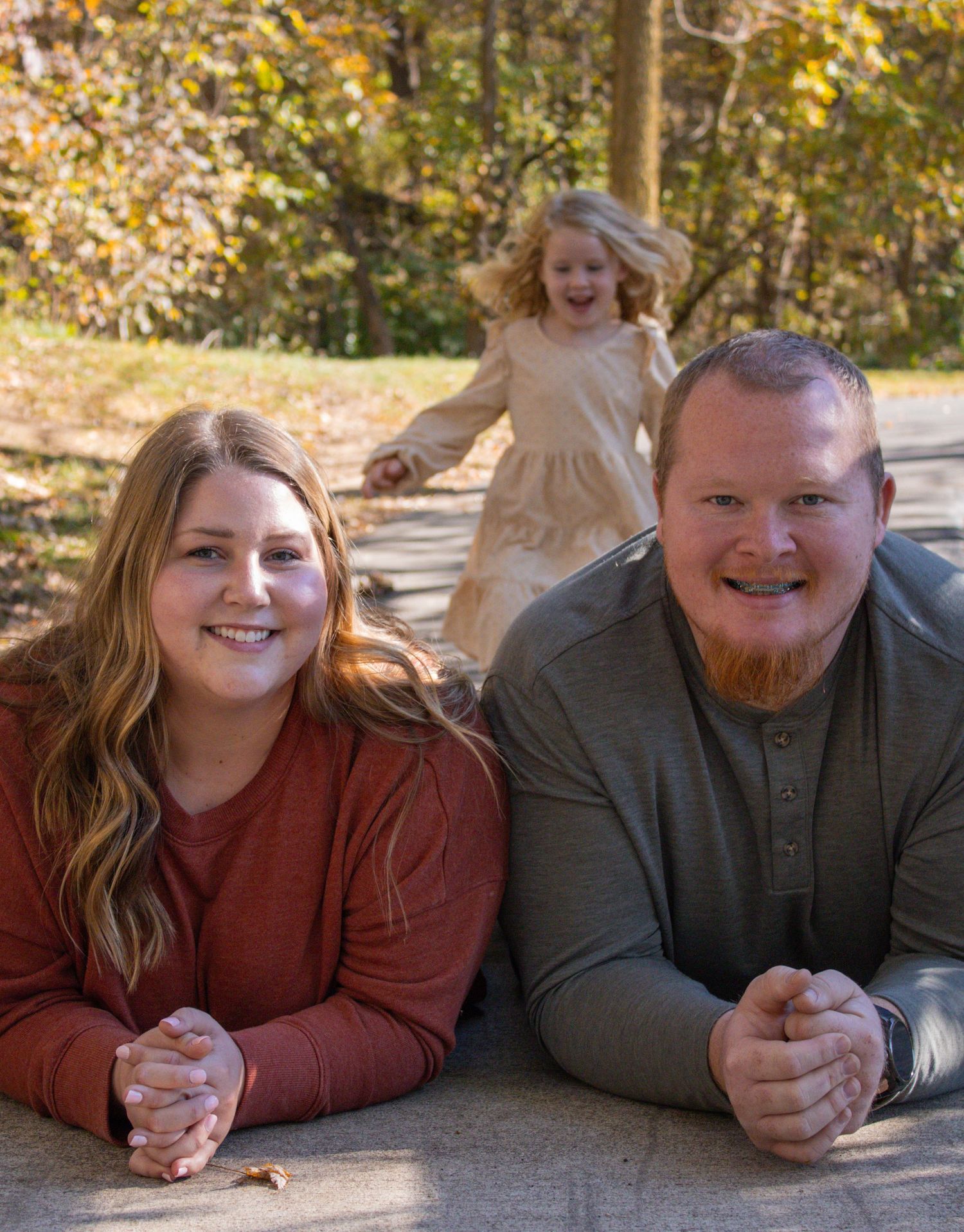 Casual family photos with autumn decorative elements and natural lighting.
