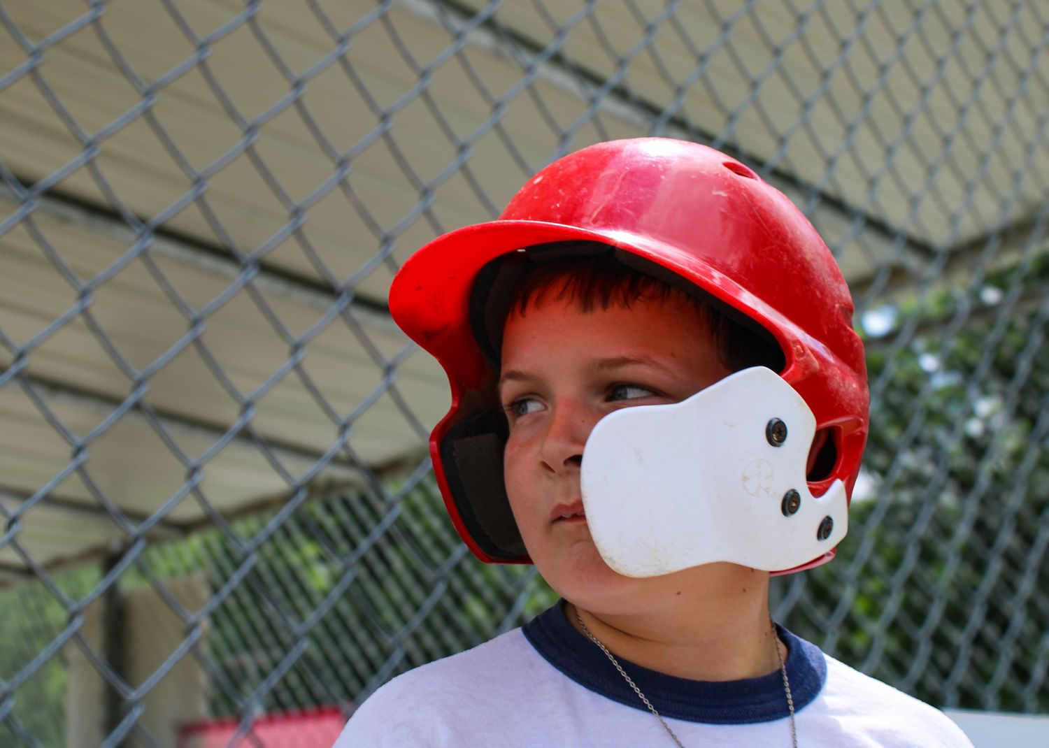 Baseball catcher crouches behind home plate during a practice session.