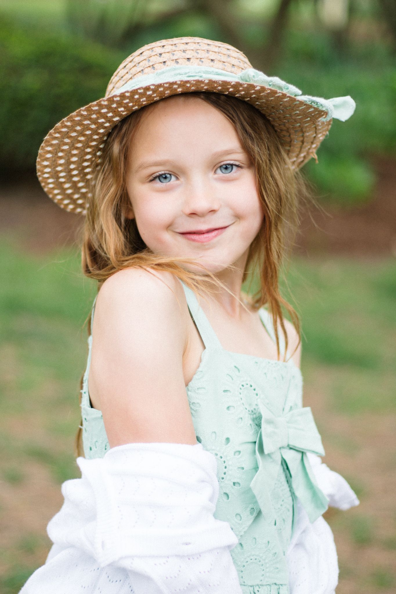 Summer portrait series in mint dress and straw hat with white lace details.