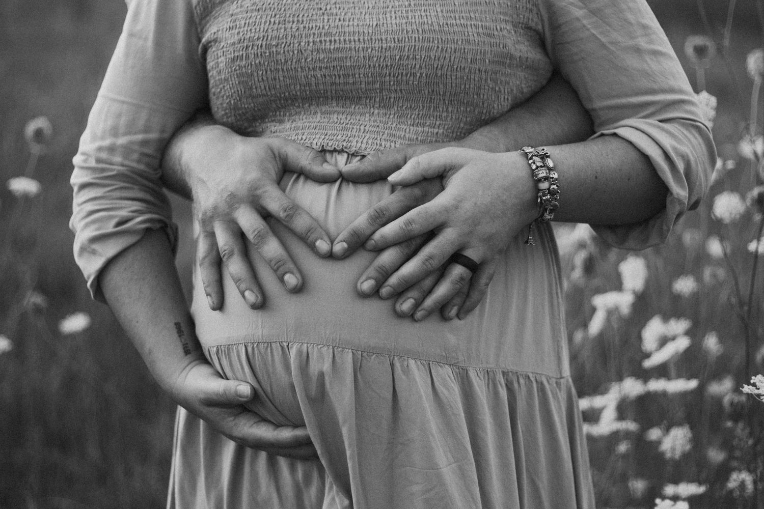 Series of maternity photos showing growing baby bump against gray dress outdoors.