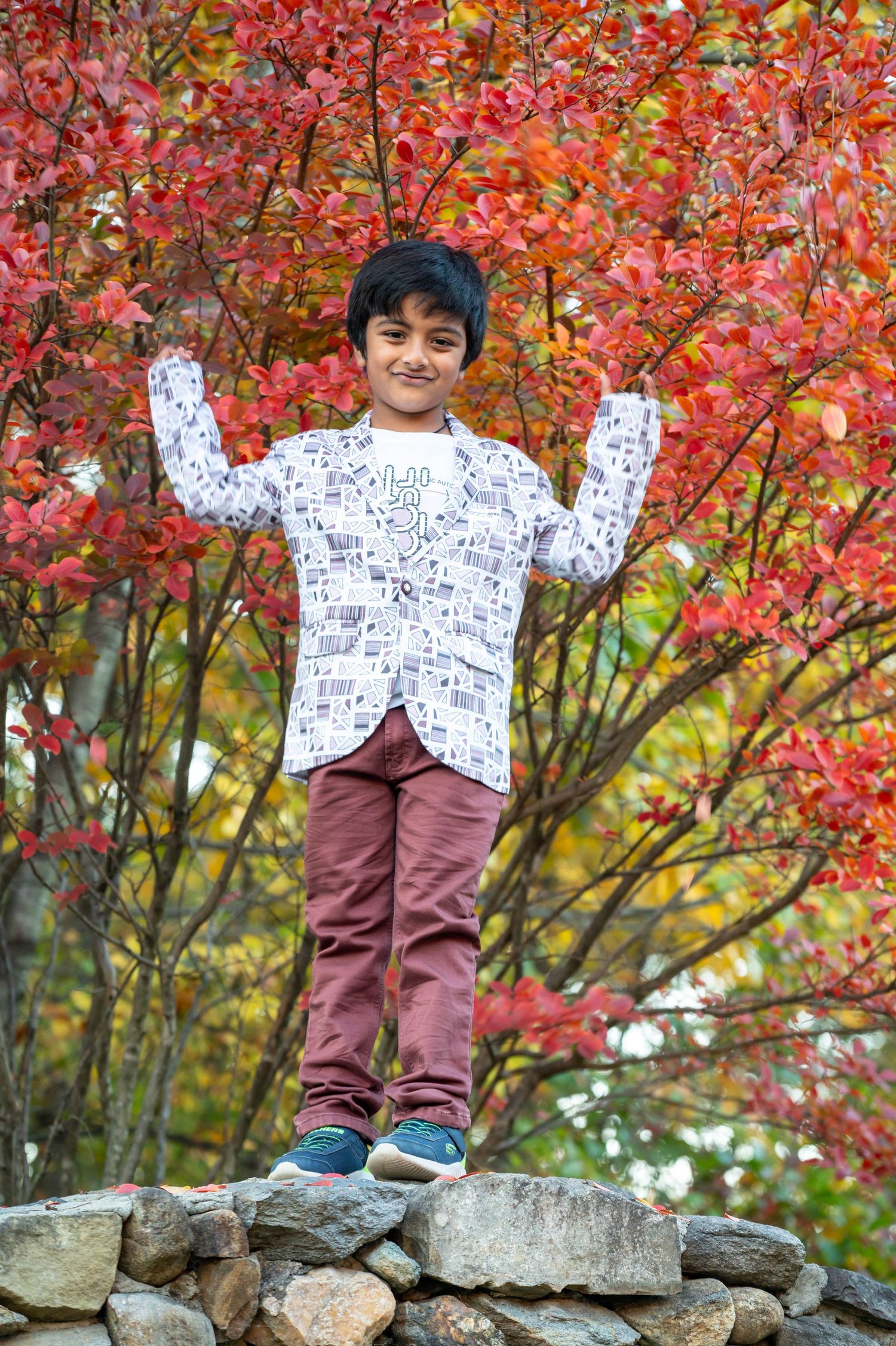 Outdoor fall portrait of a boy captured in natural light by ek-framedmemories
