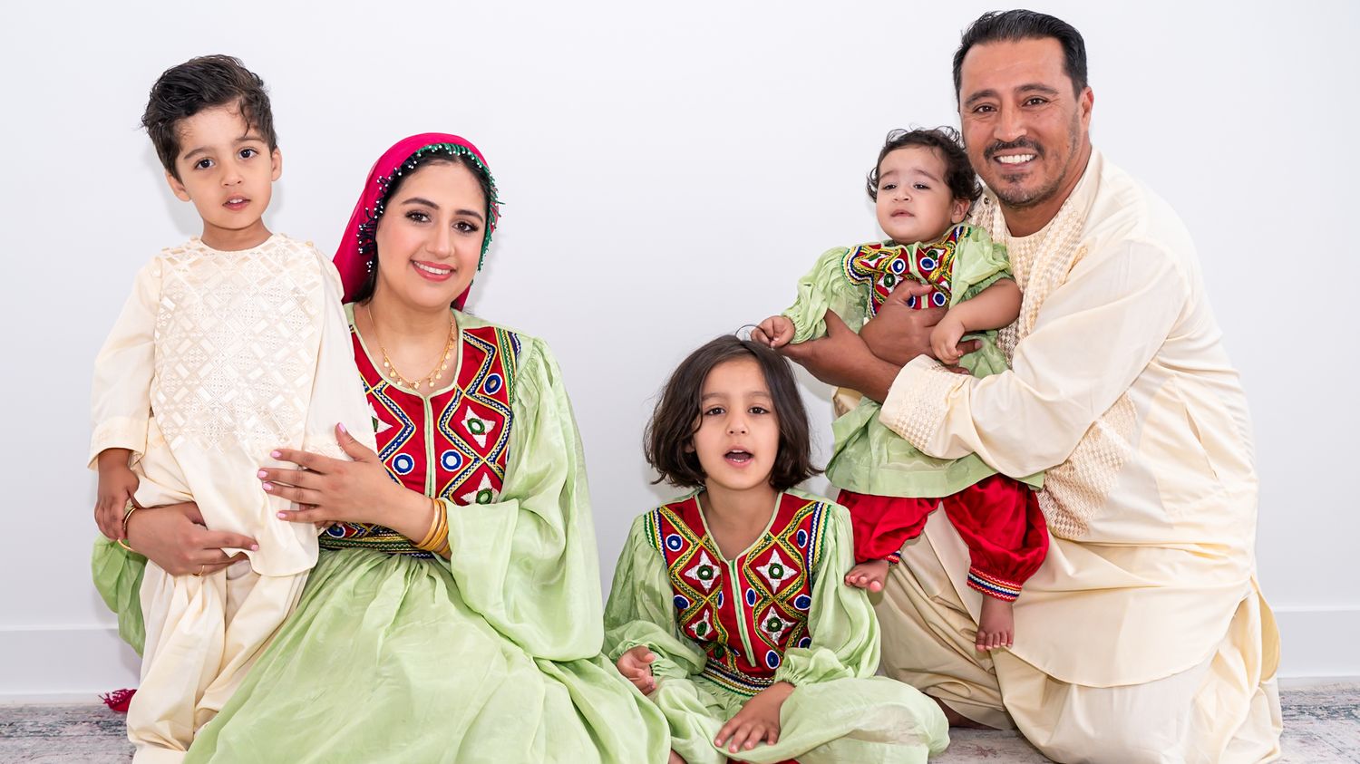 Family portrait with mom and three kids in a natural light studio session