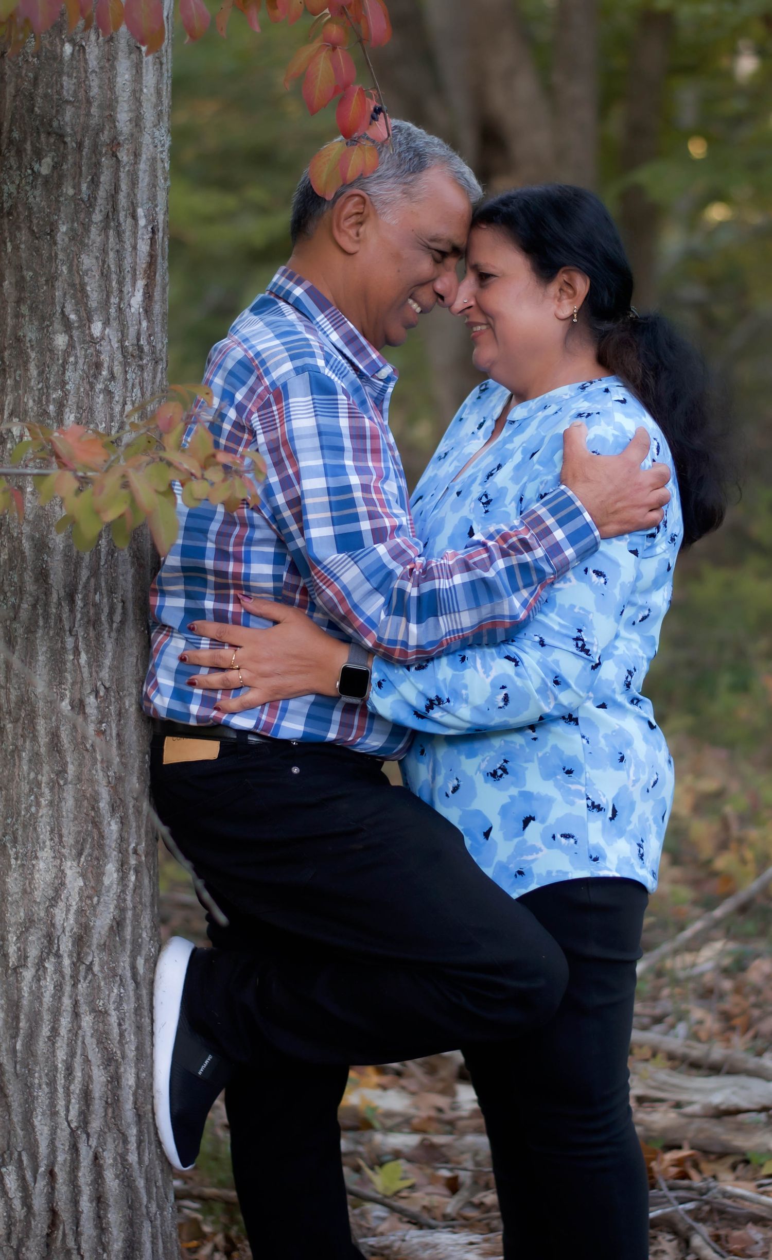 Autumn outdoor portrait of a couple captured among fall foliage in Northern Virginia