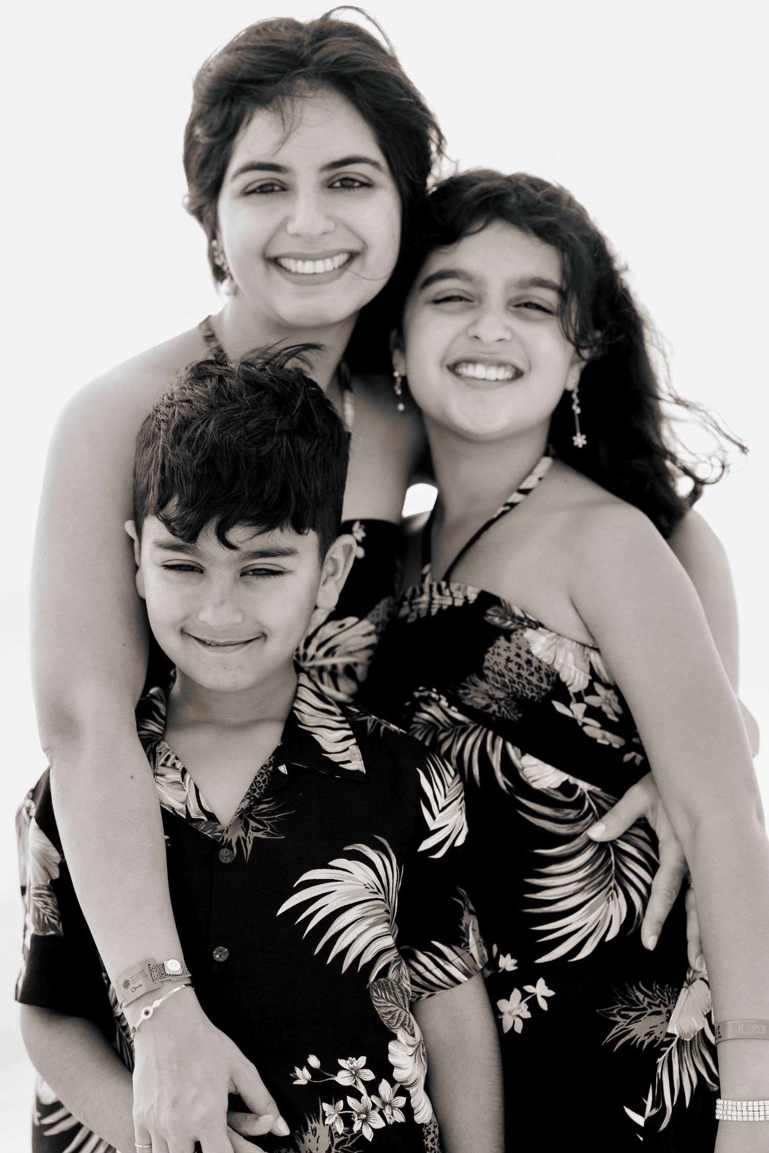 Ekta Khatri and her two kids captured in a family-style portrait for the About page