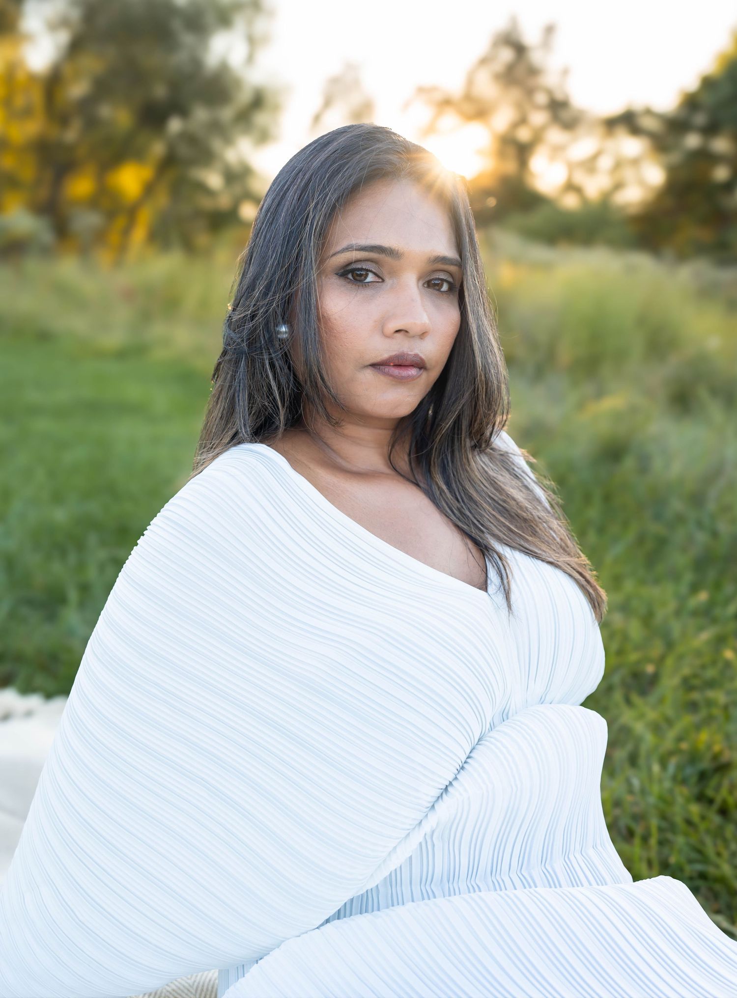 Outdoor portrait of a woman captured in natural light by ek-framedmemories