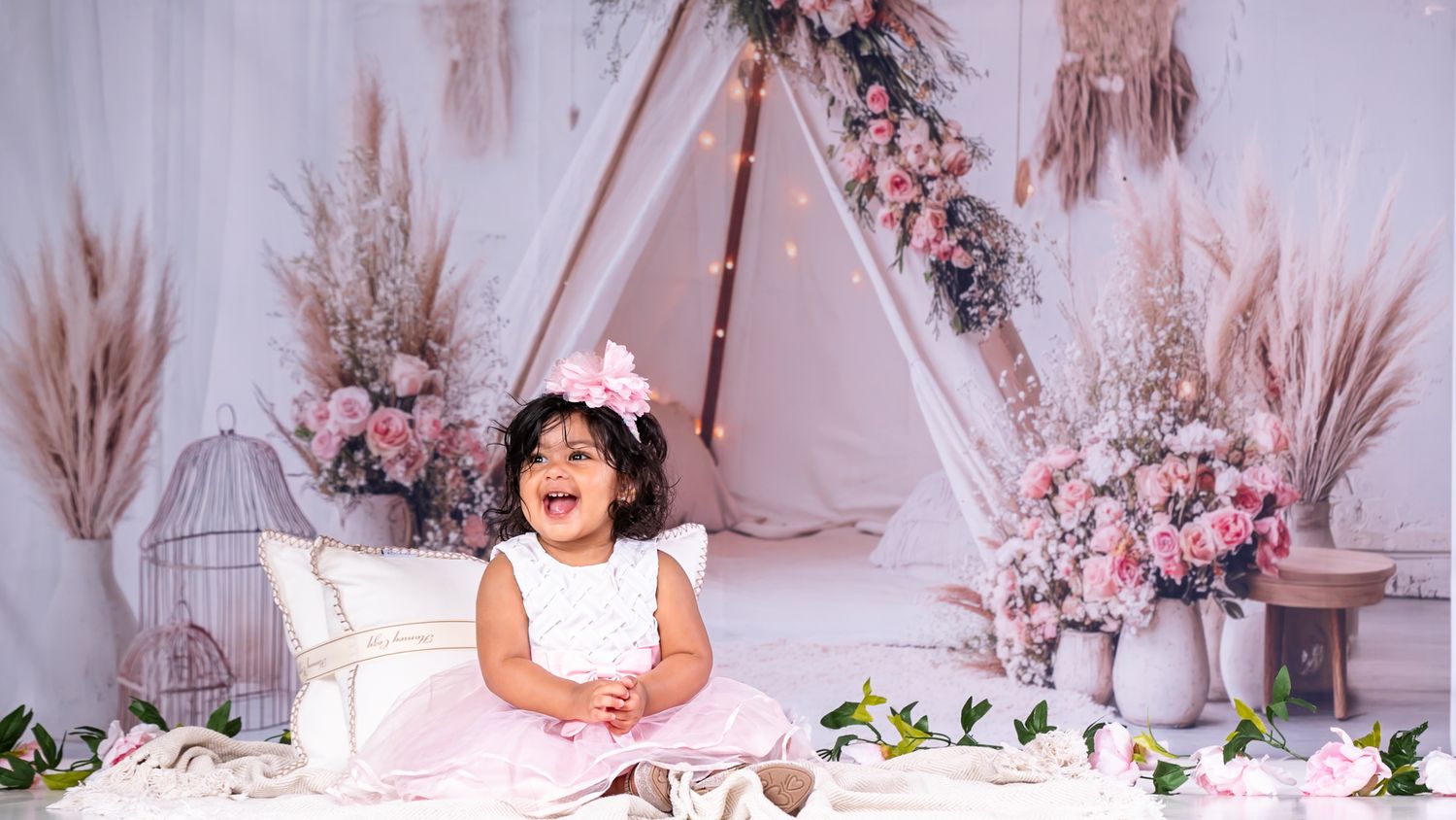 One-year-old baby portrait in a boho-themed studio session by ek-framedmemories