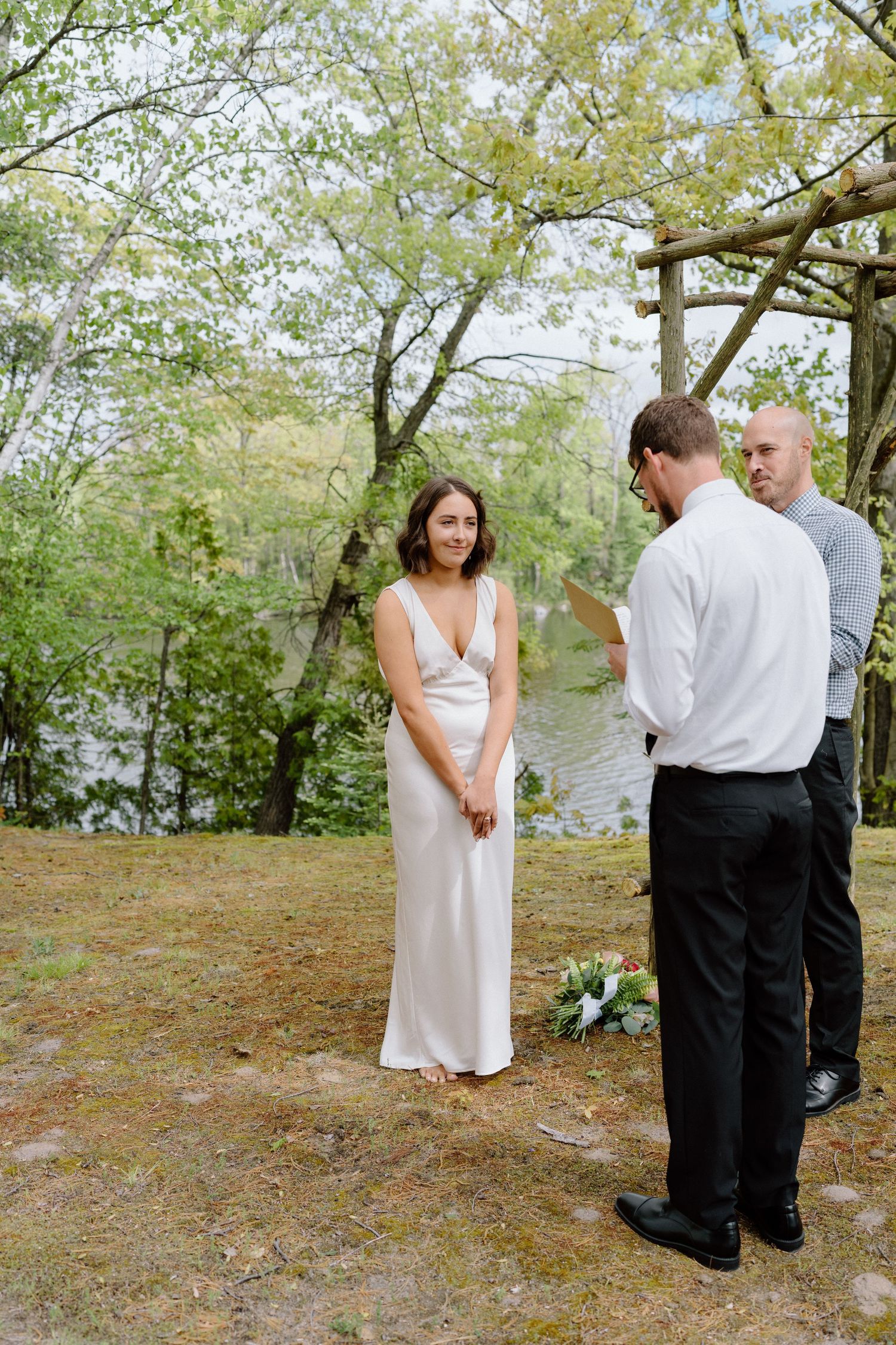 A couple shares a tender moment during their outdoor wedding photoshoot.