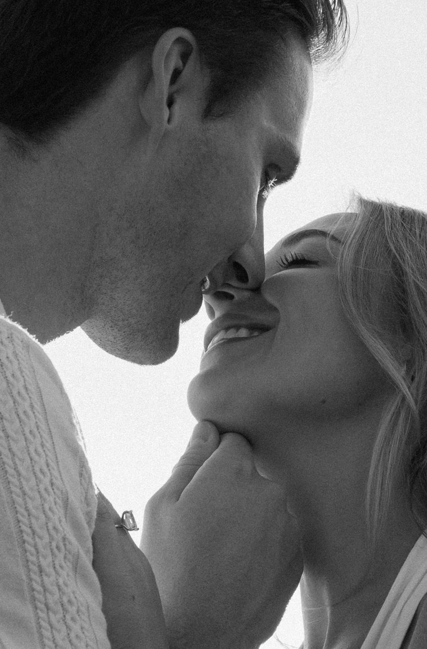 A romantic black and white photo series showing a couple in an intimate close-up moment about to kiss.