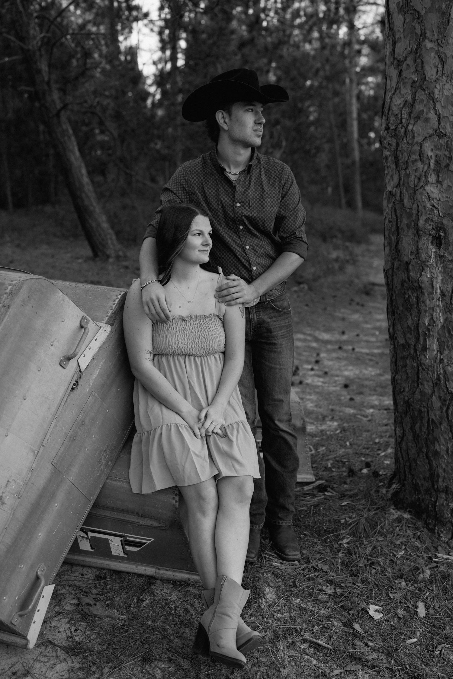 Artistic black and white portraits captured in a wooded forest setting.