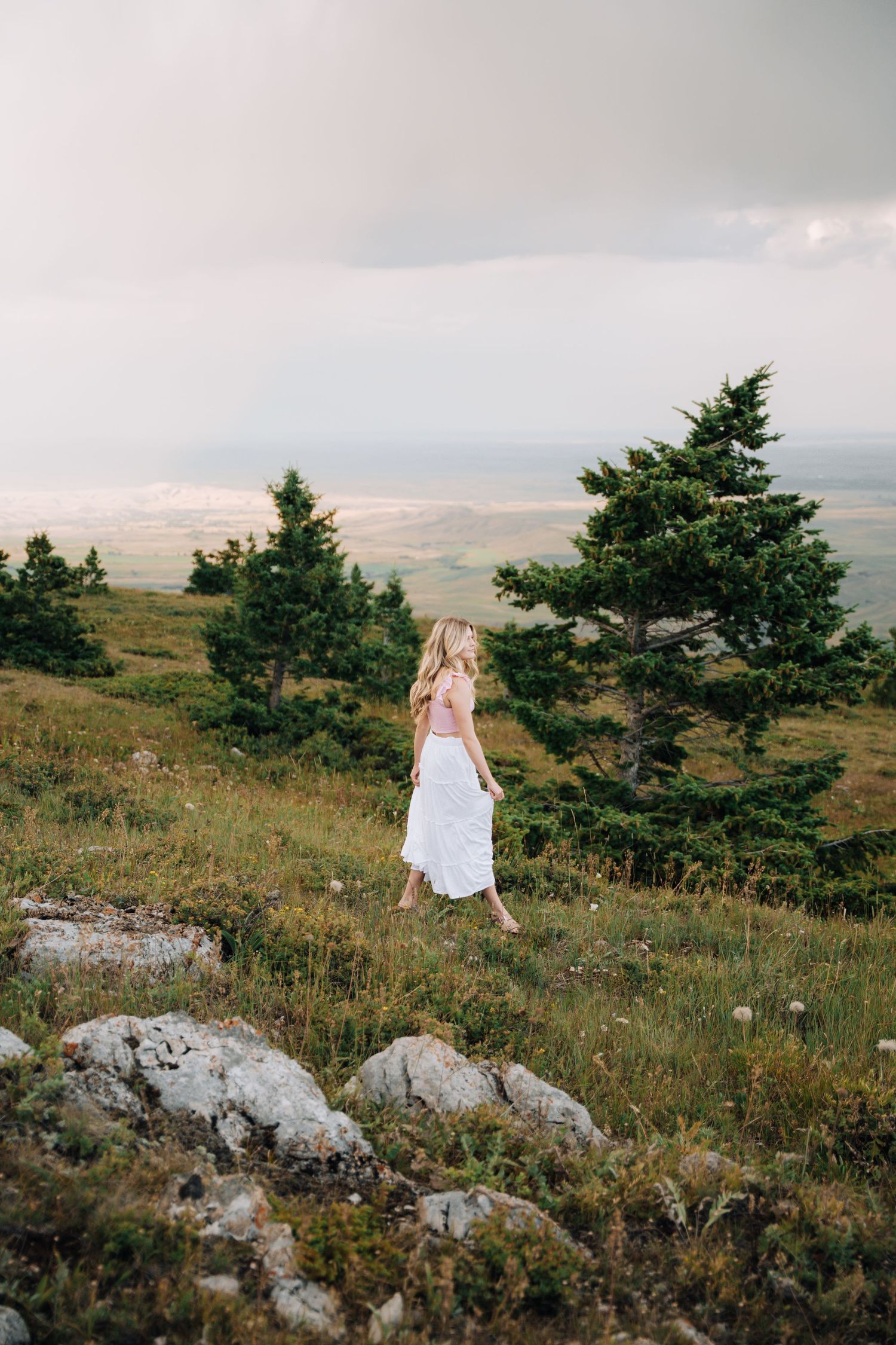 Candid photo of a girl walking in a field.