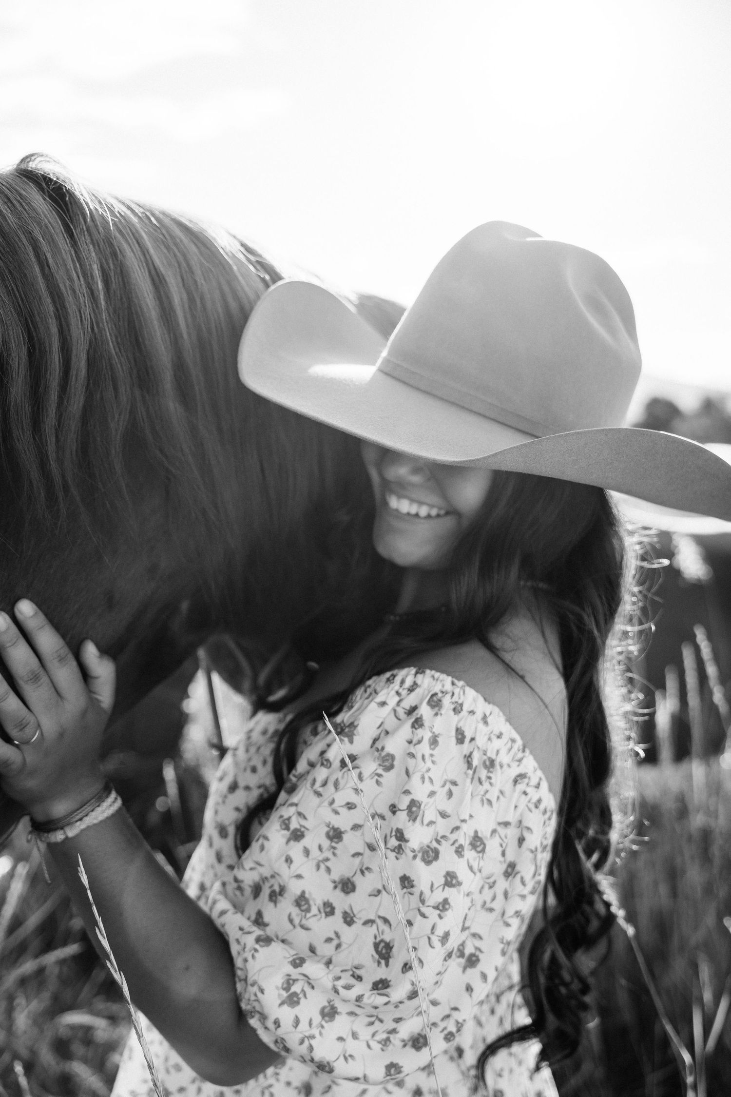 Girl standing next to a horse