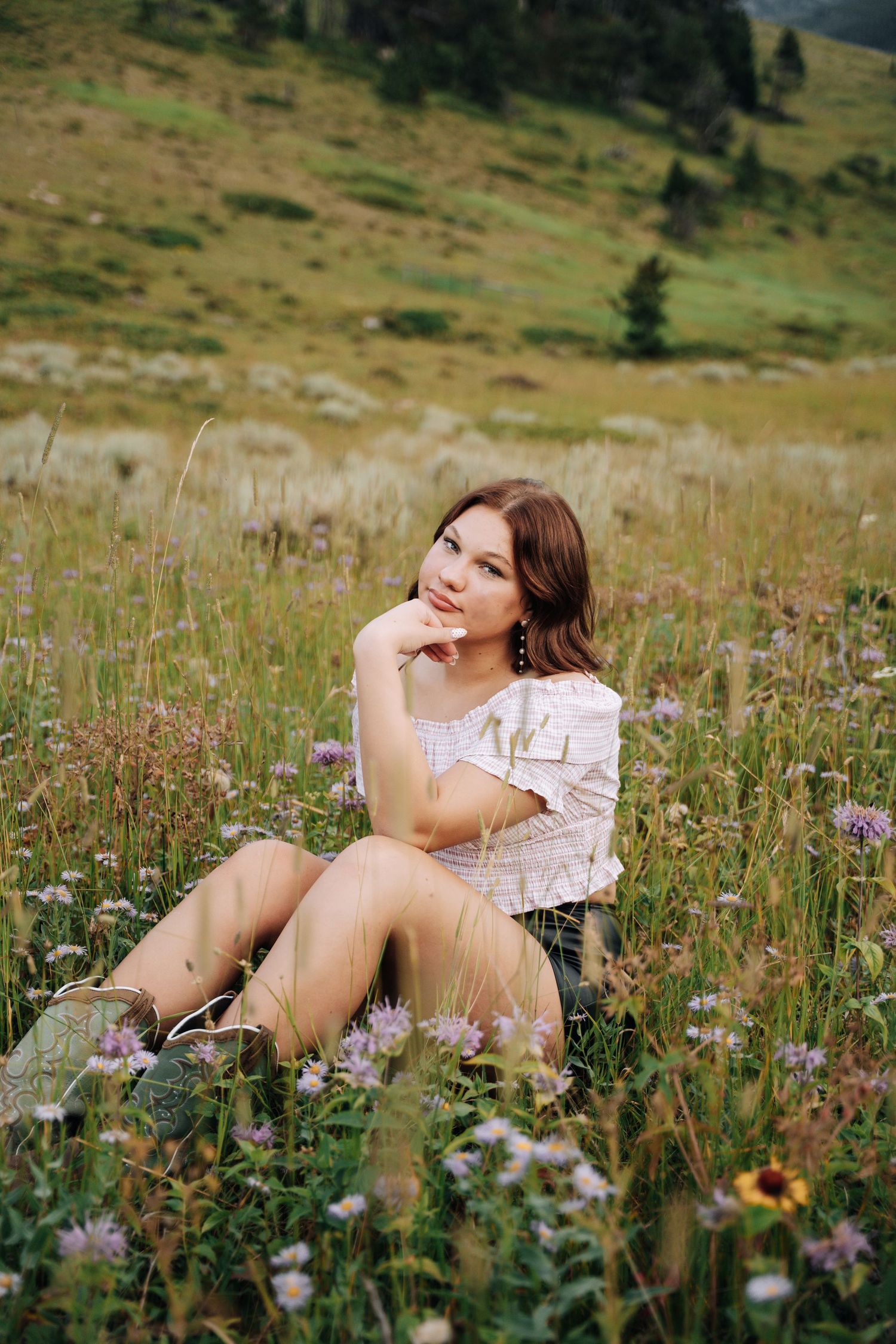 Girl sitting in a flower field