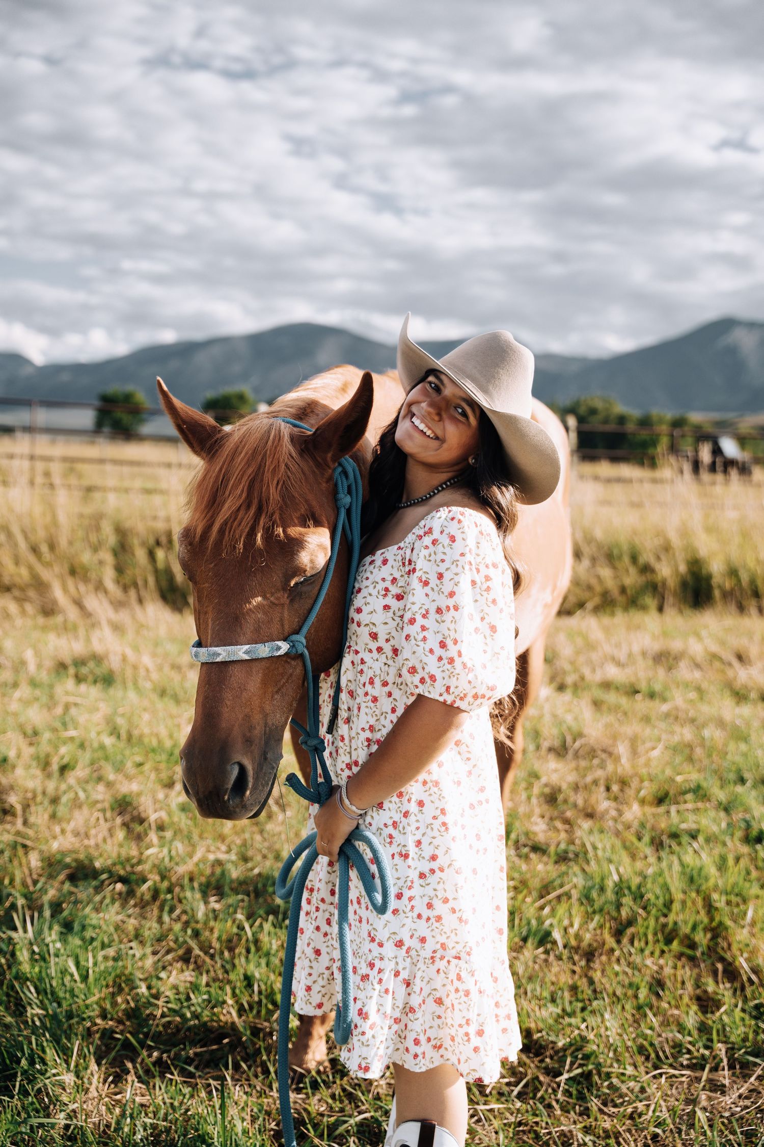Girl standing next to a horse