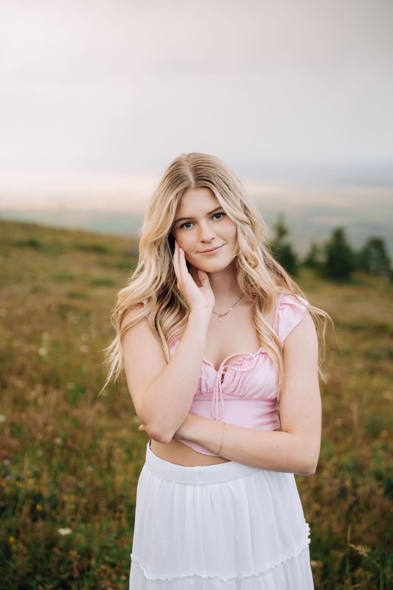 Girl Posing looking at the camera in a flowy skirt.
