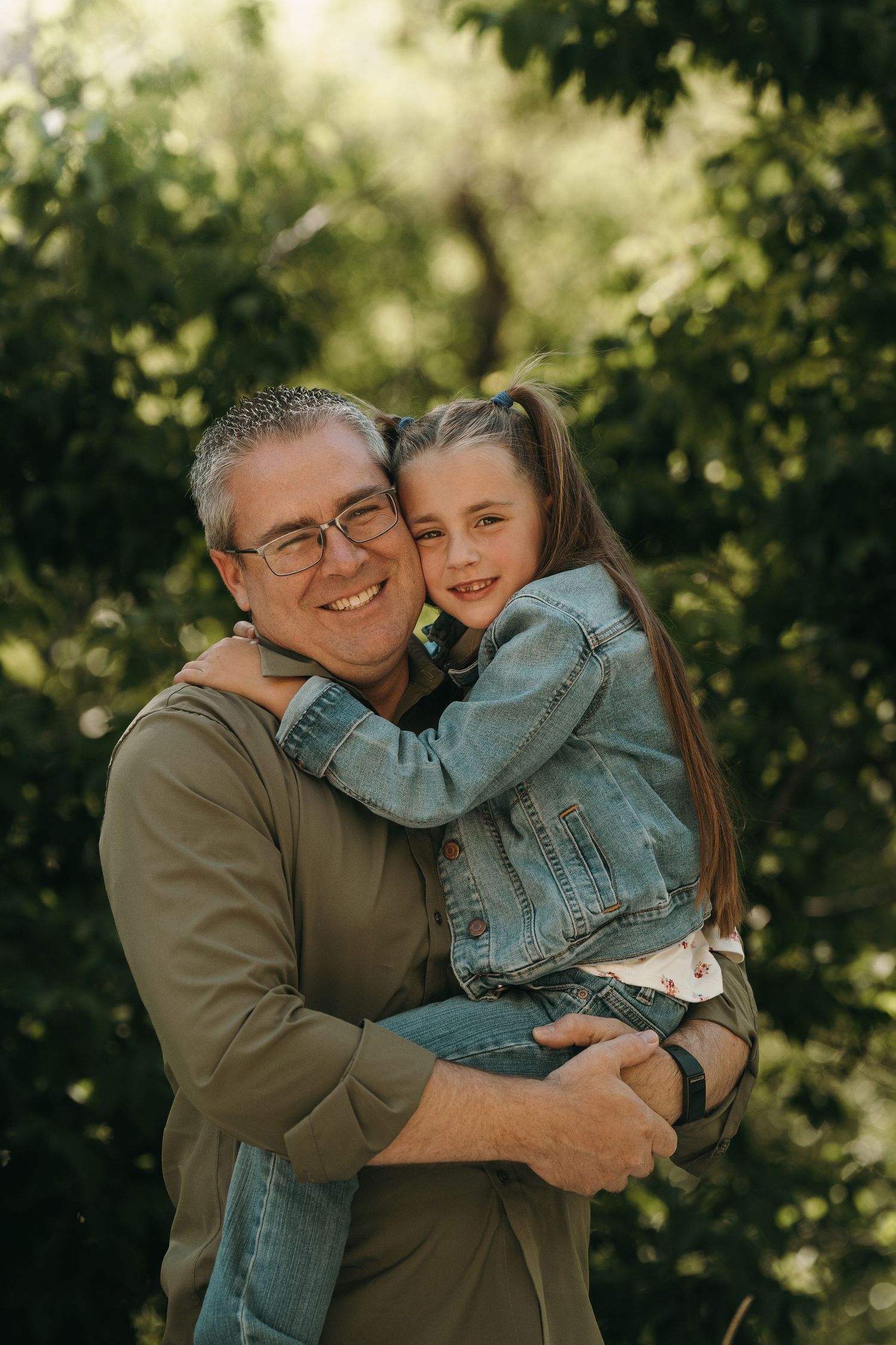 Dad posing with one of his children.