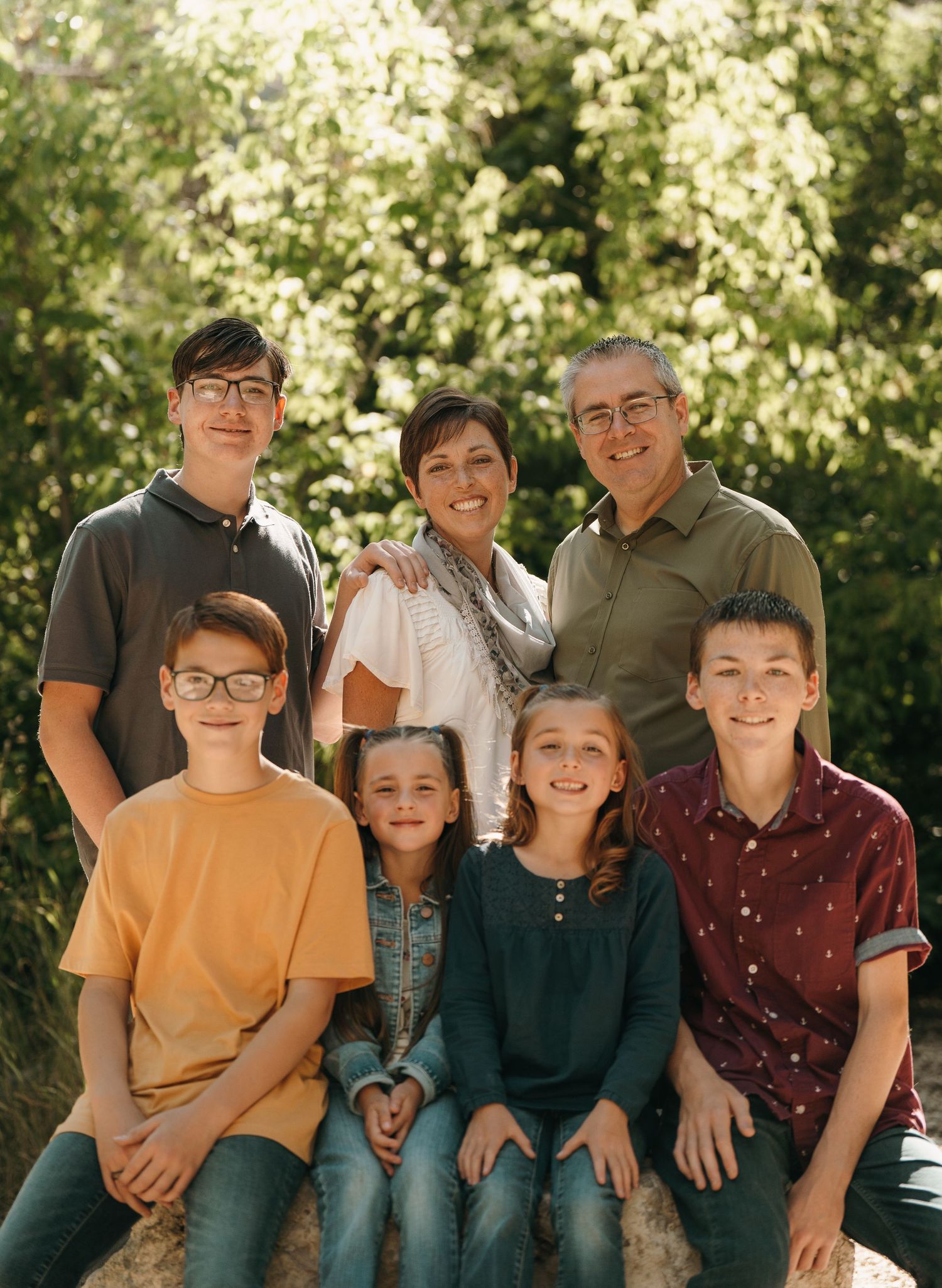 Posed family photo, some sitting and some standing.