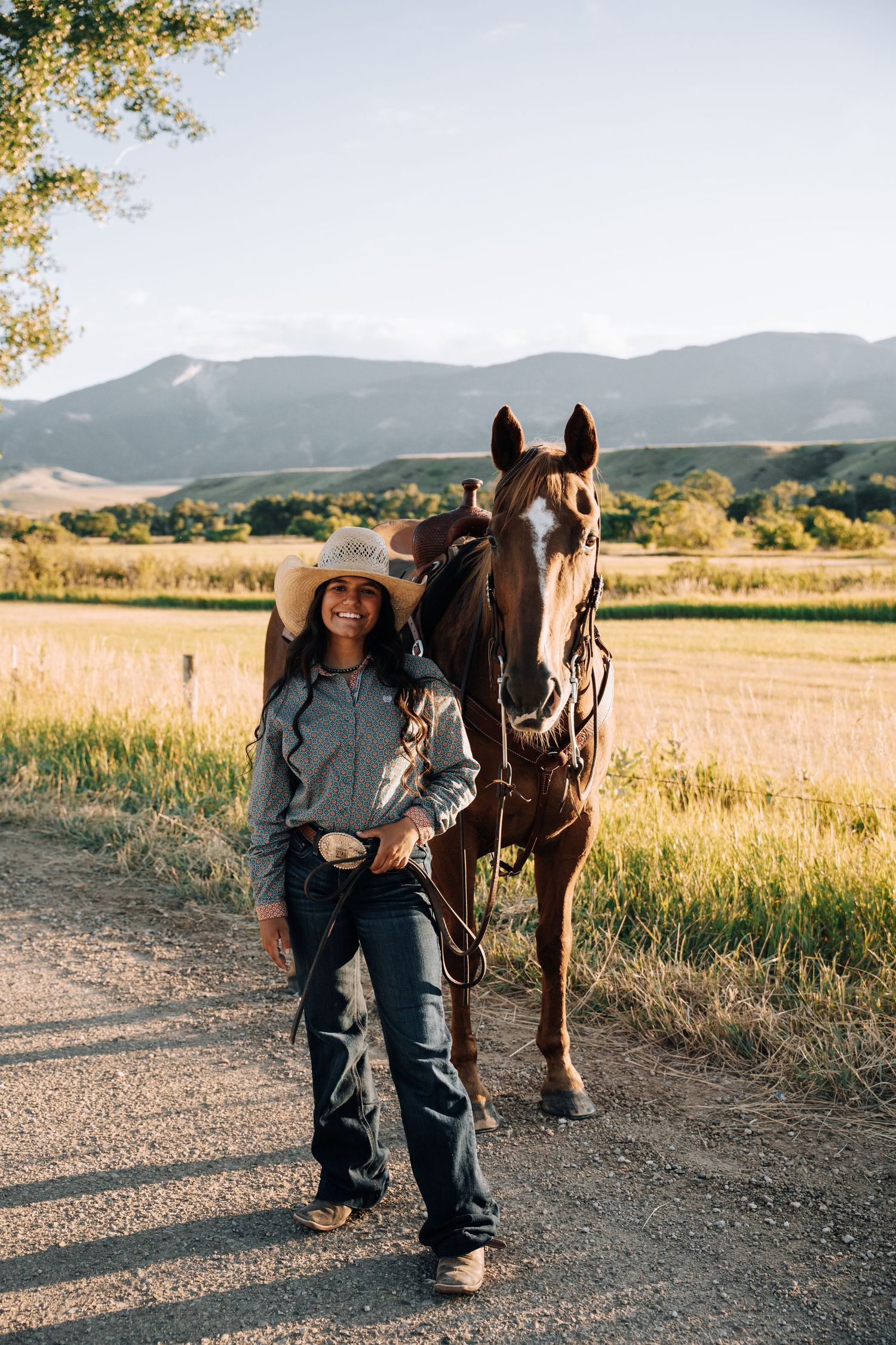 Girl standing next to a horse