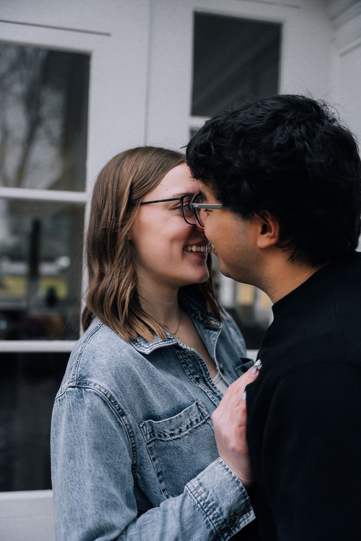 couple smiling and kissing.