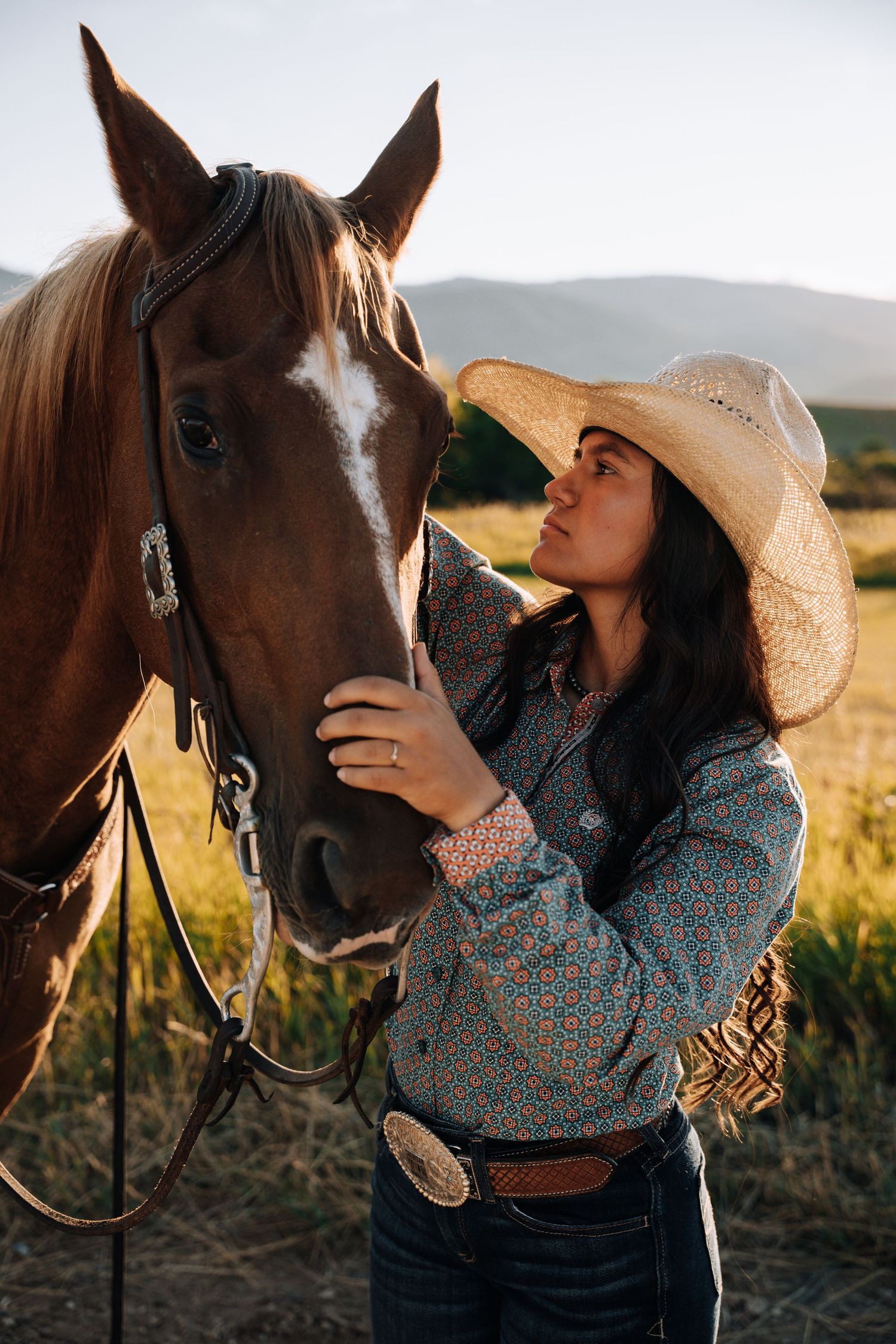 Girl standing next to a horse