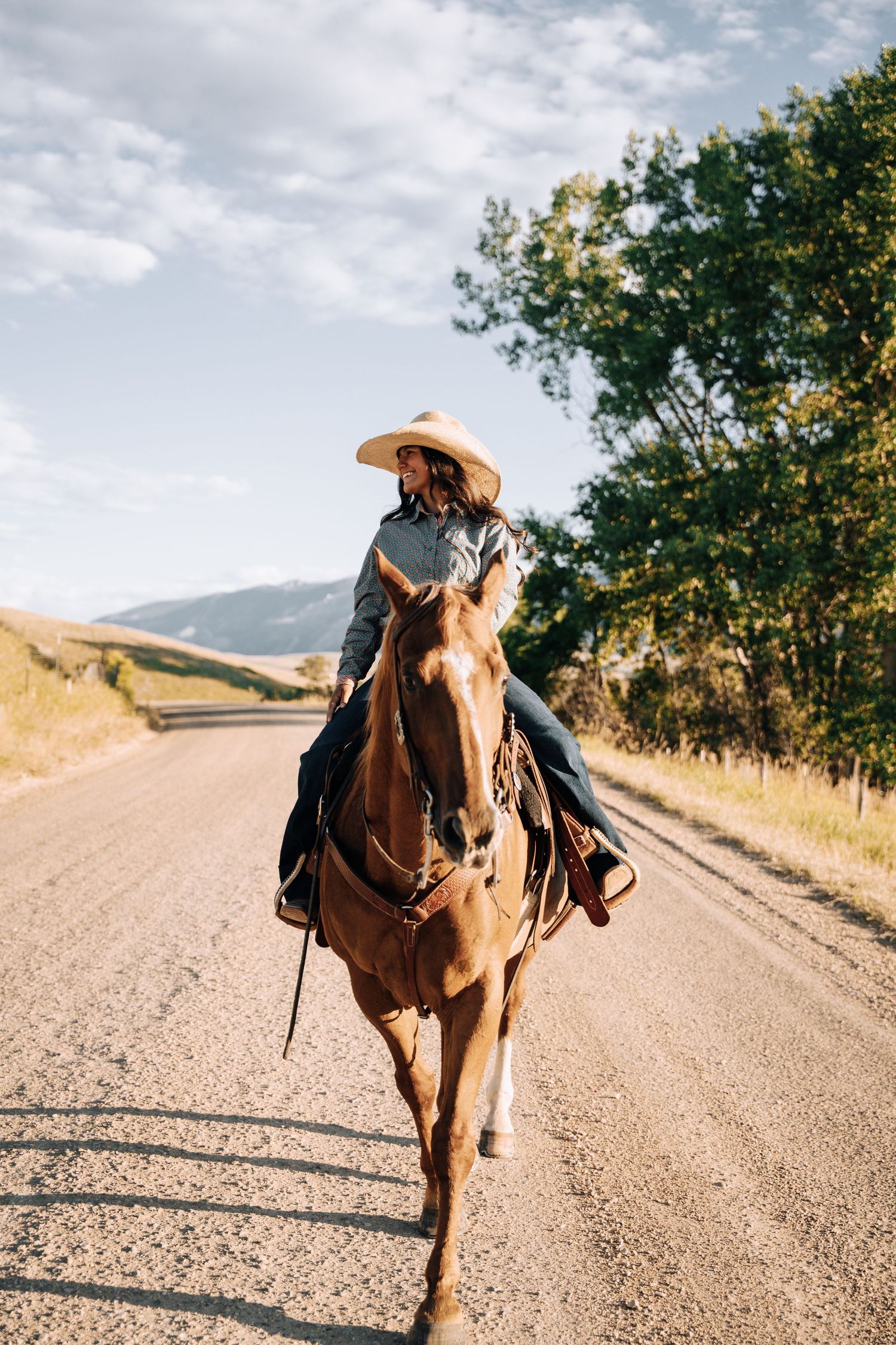 Girl on a horse looking away from the camera