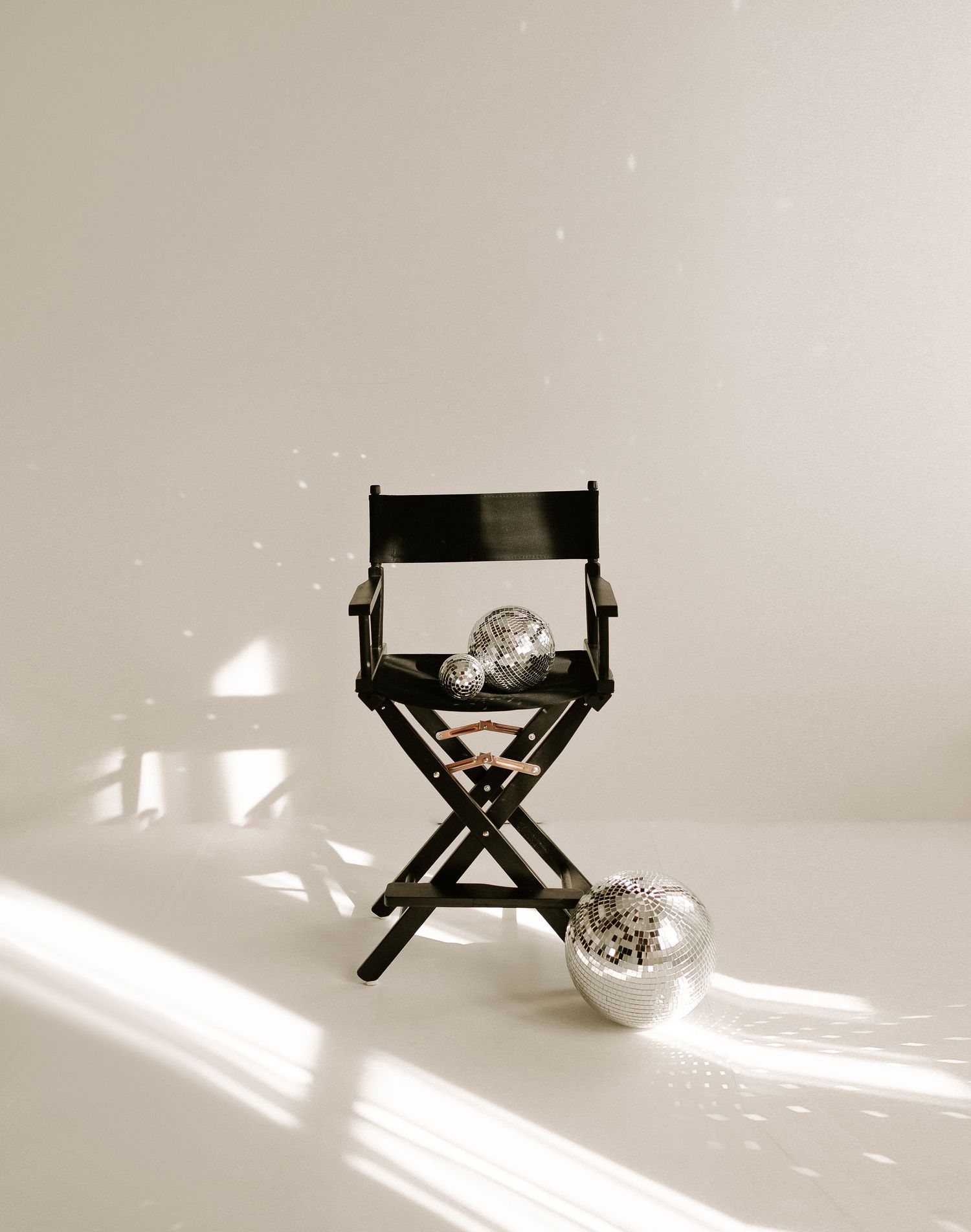 Director's chair casting dramatic shadows in a bright minimalist setting.