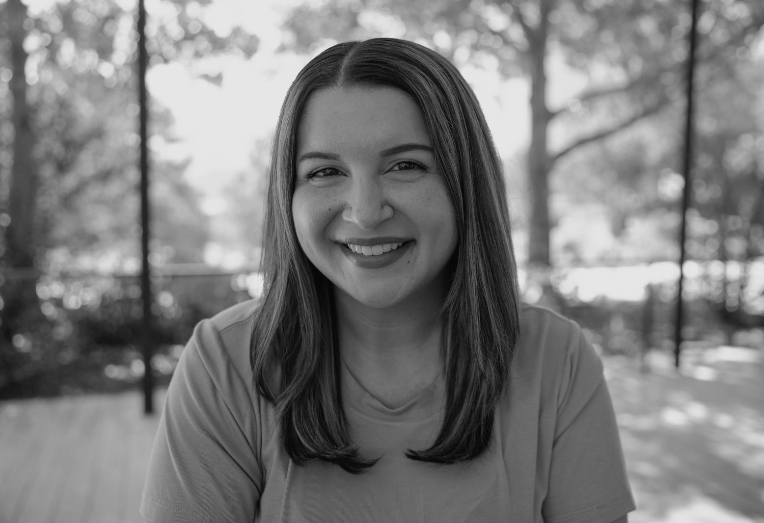 Black and white portrait series capturing natural expressions and smiles.