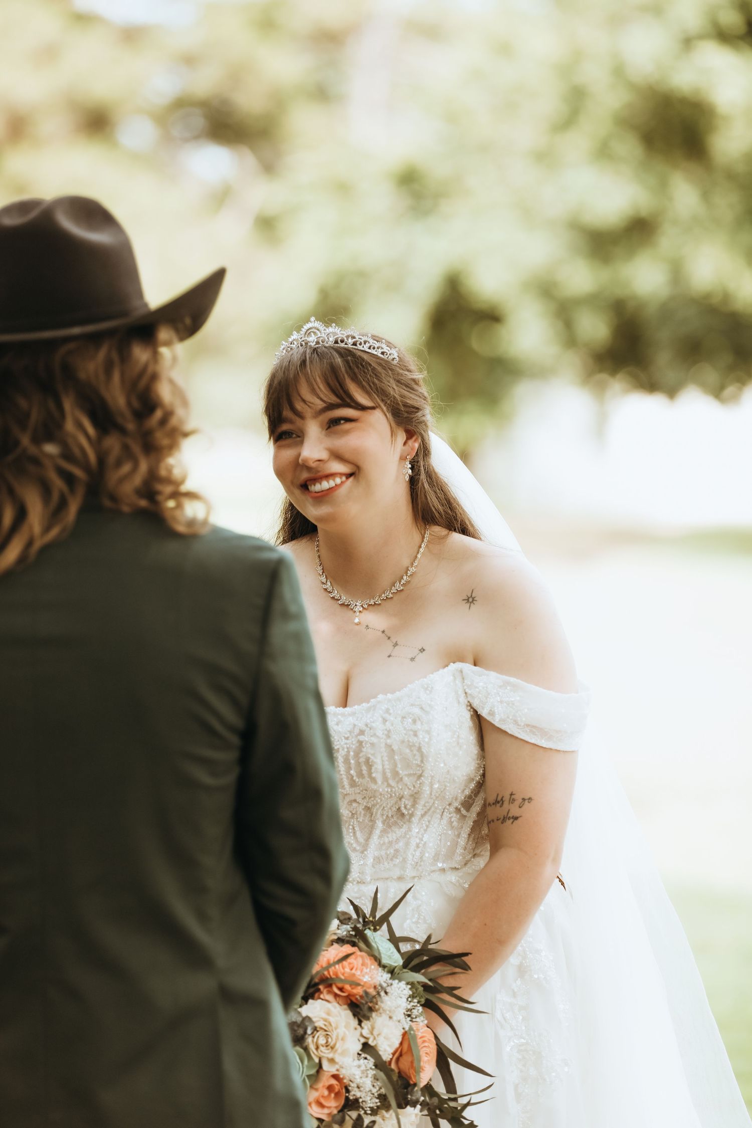 Couple shares intimate moment during outdoor wedding ceremony.