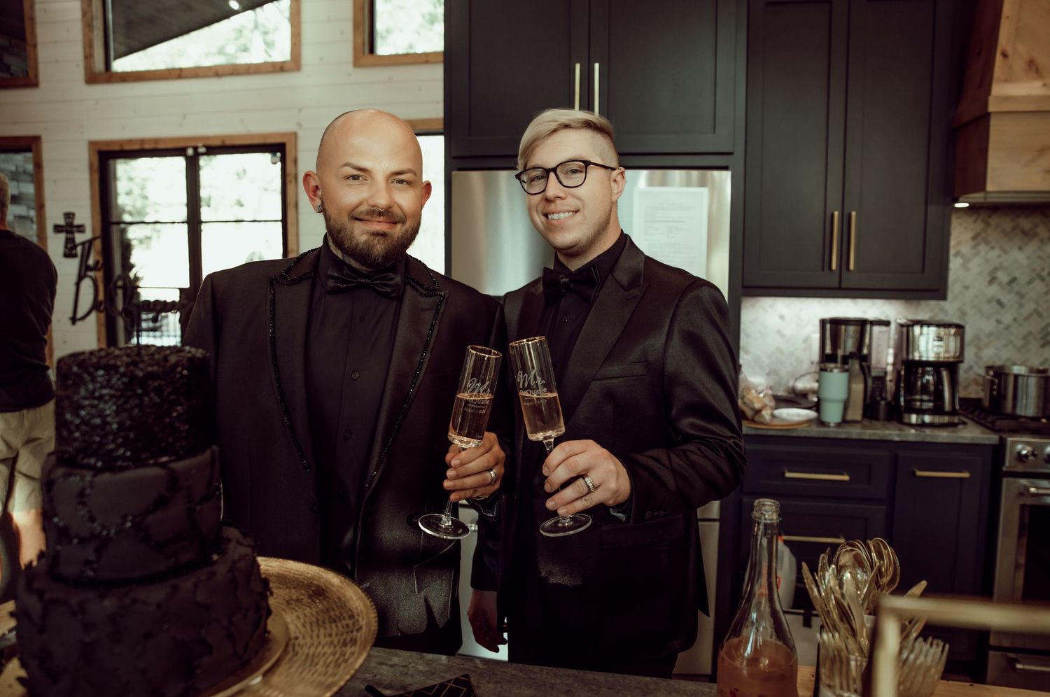 Newly Weds enjoying drinks and conversation at modern kitchen counter.