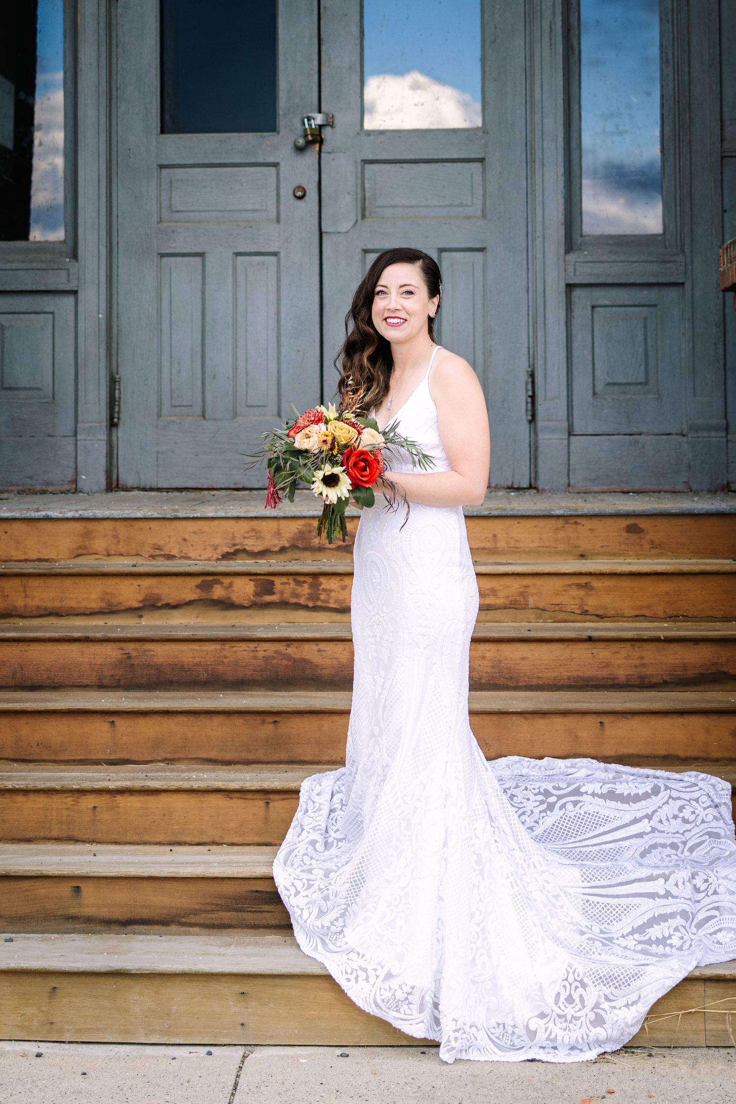 A series of photos showing a bride in a white lace wedding dress posing on rustic wooden steps.