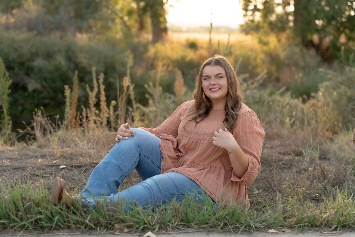 Outdoor autumn portrait in a rustic natural setting.