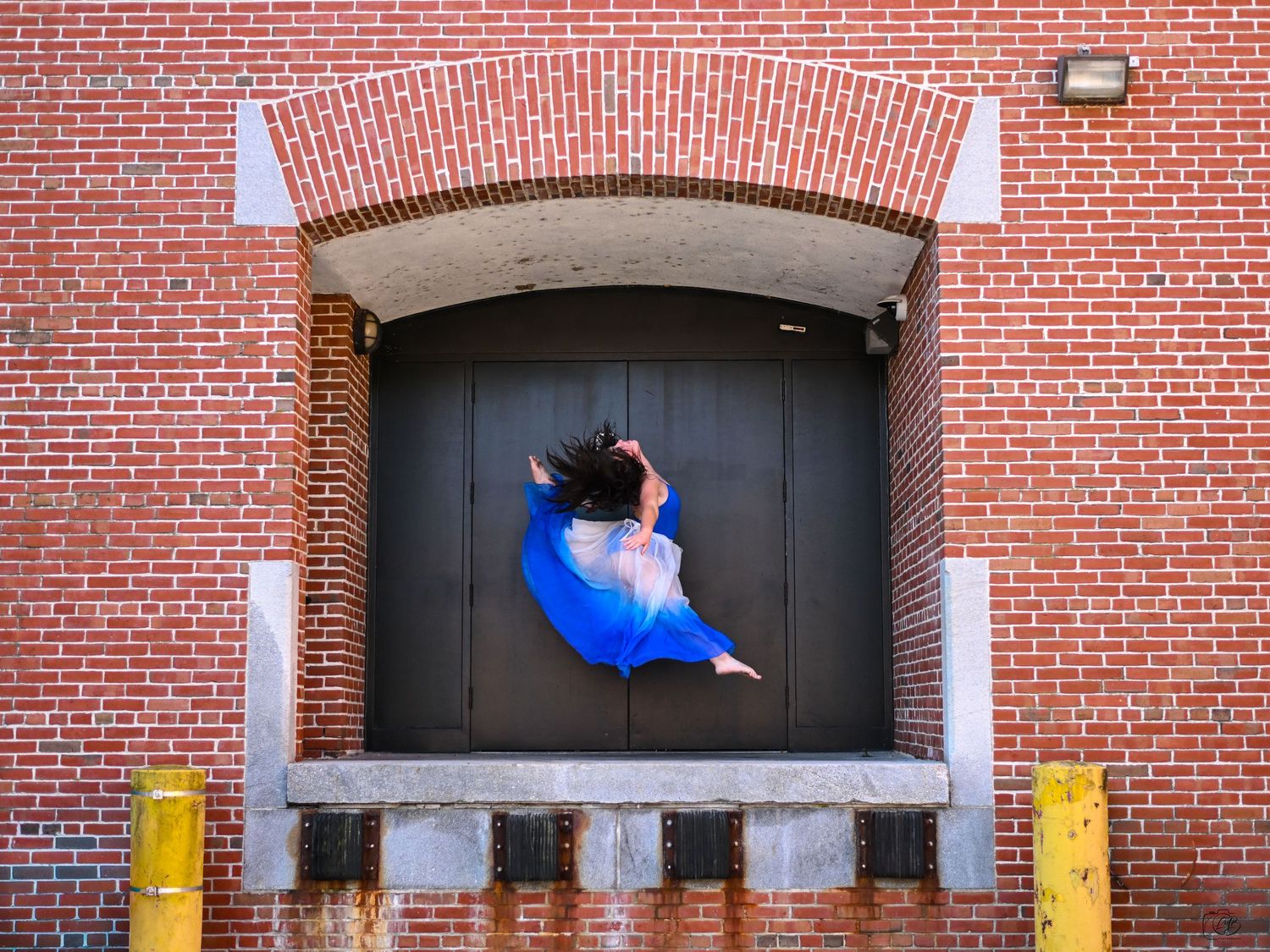 A sequence of photos shows a person in blue jumping through a window opening in a brick wall.