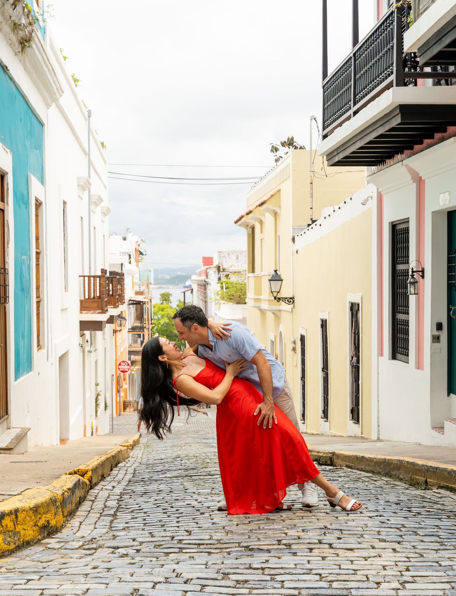 A romantic dance dip pose on a charming cobblestone street in Old San Juan. Pueto rico