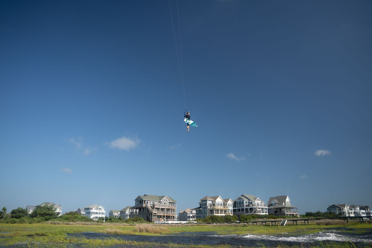 Kiteboarder jumping in the flats