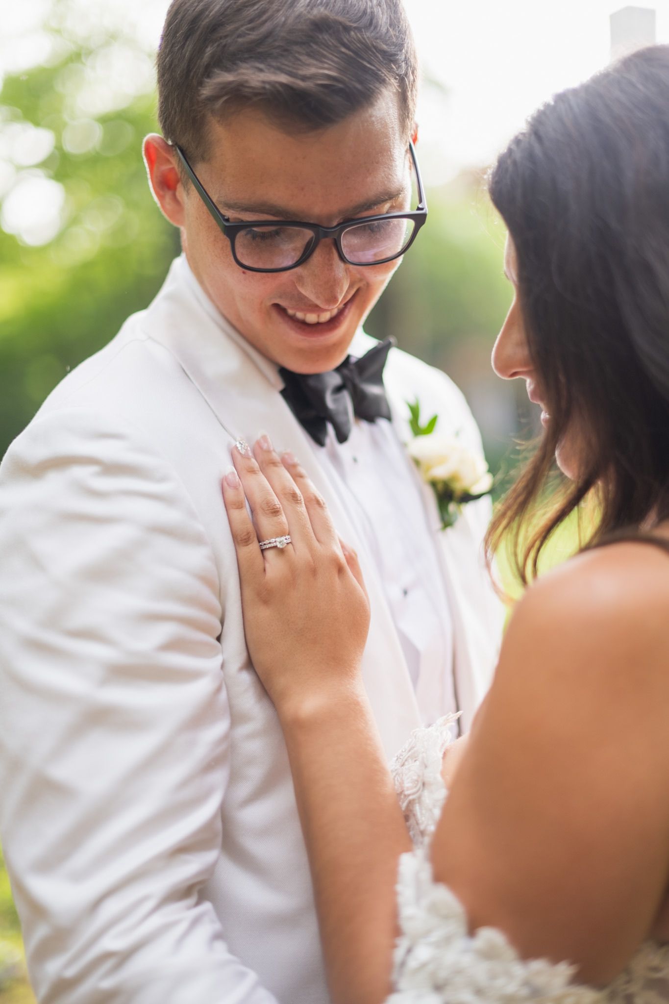 Close-up shots of wedding couple sharing emotional moments during outdoor ceremony.