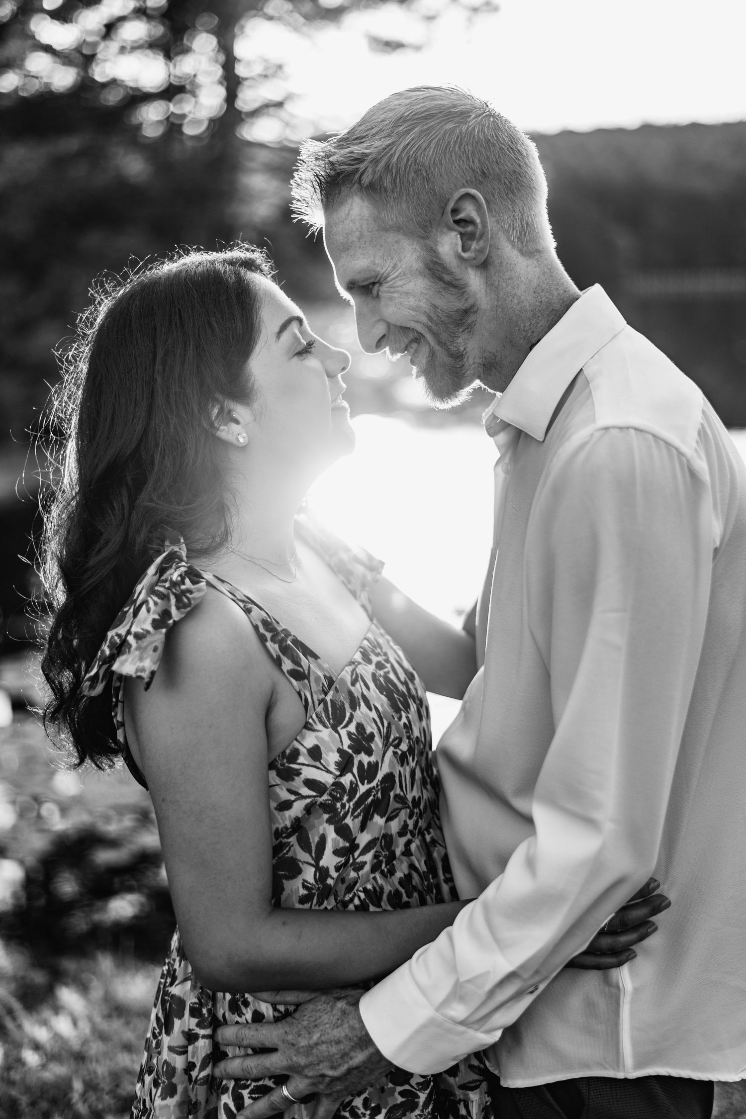 A romantic black and white photo series showing an intimate outdoor couple's portrait session.