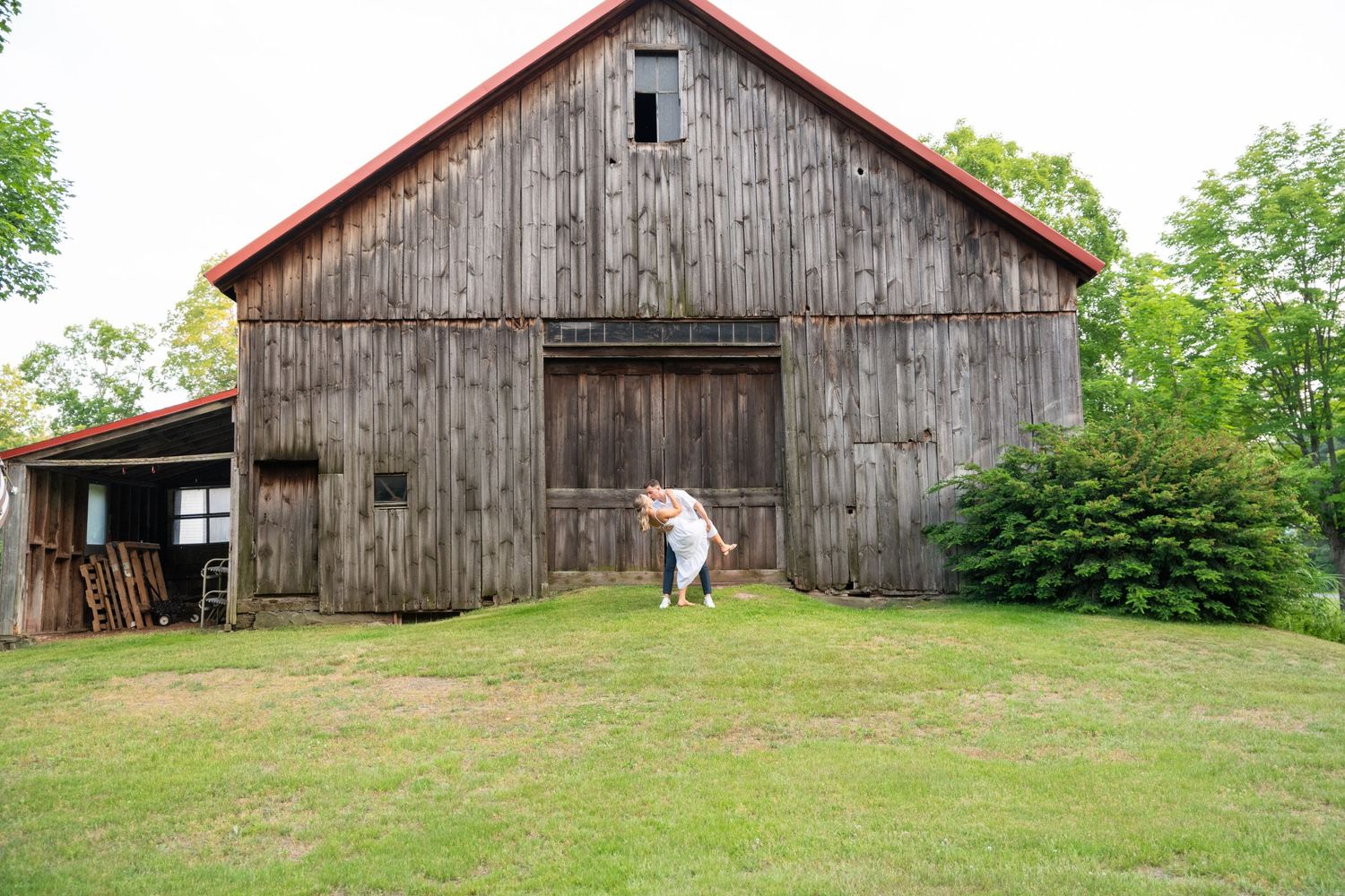 Series of views showing weathered rustic barn structure in countryside setting.