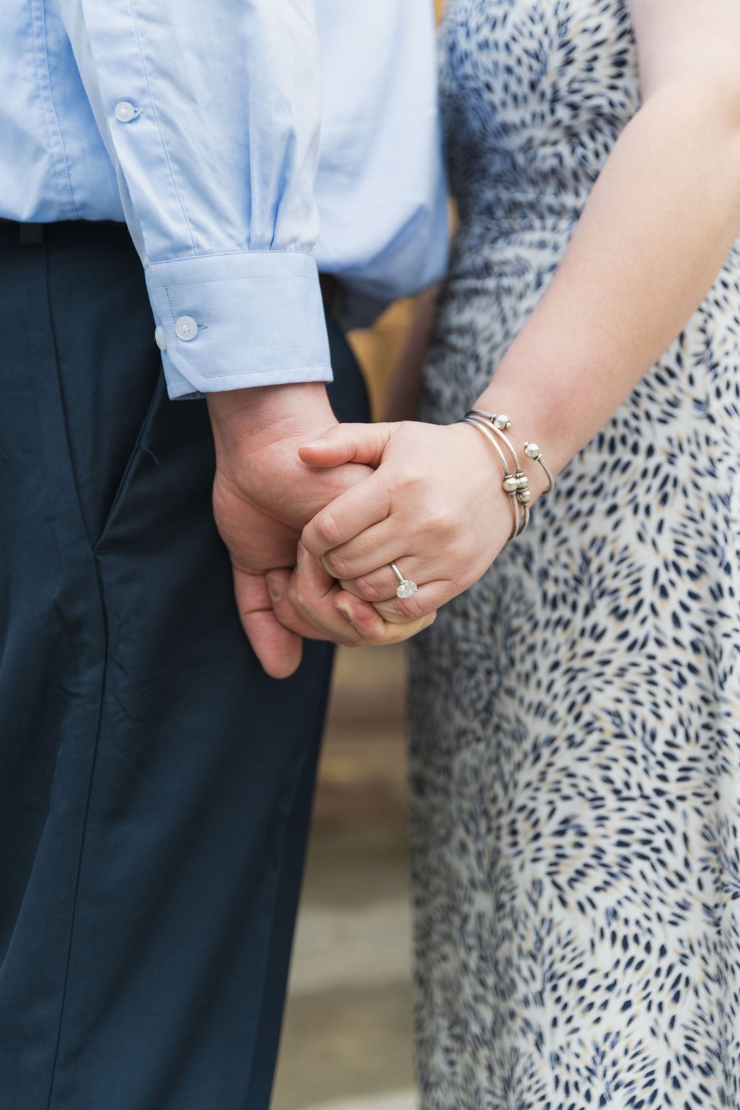 Close-up shots of hands and rings during an intimate portrait session.