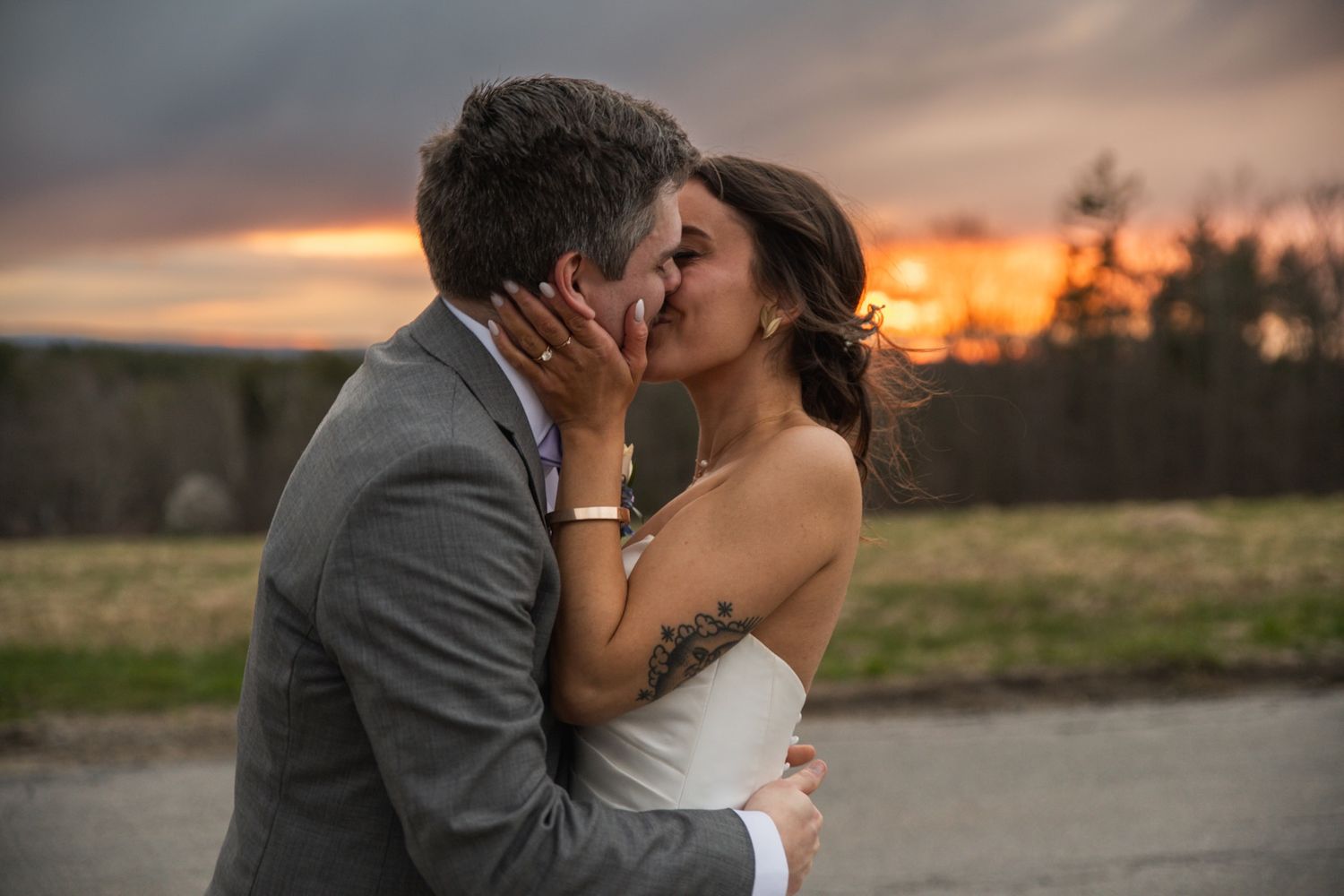 Romantic sunset silhouettes of a couple sharing intimate moments outdoors.