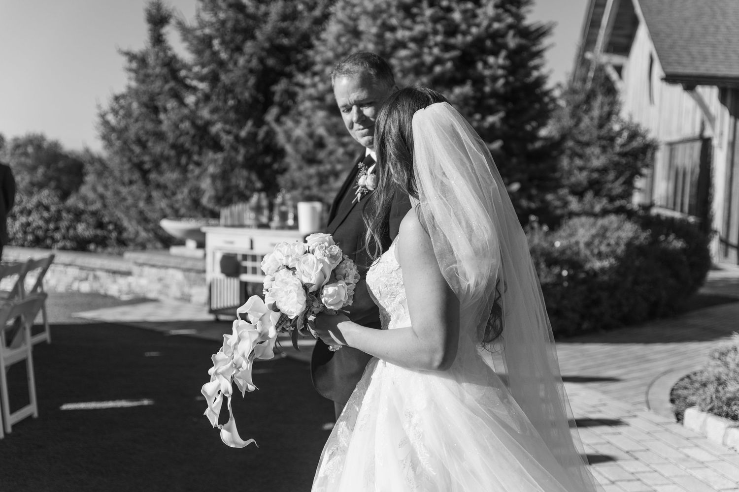 A black and white photo collage showing wedding moments including dancing, embraces, and outdoor celebrations.