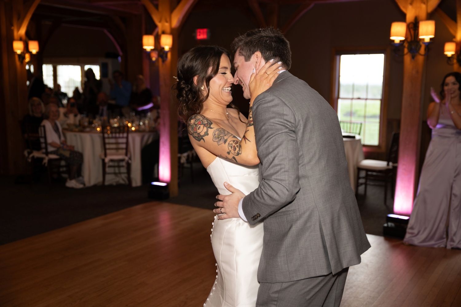 Wedding reception dance captured in warm lighting with romantic ambiance.